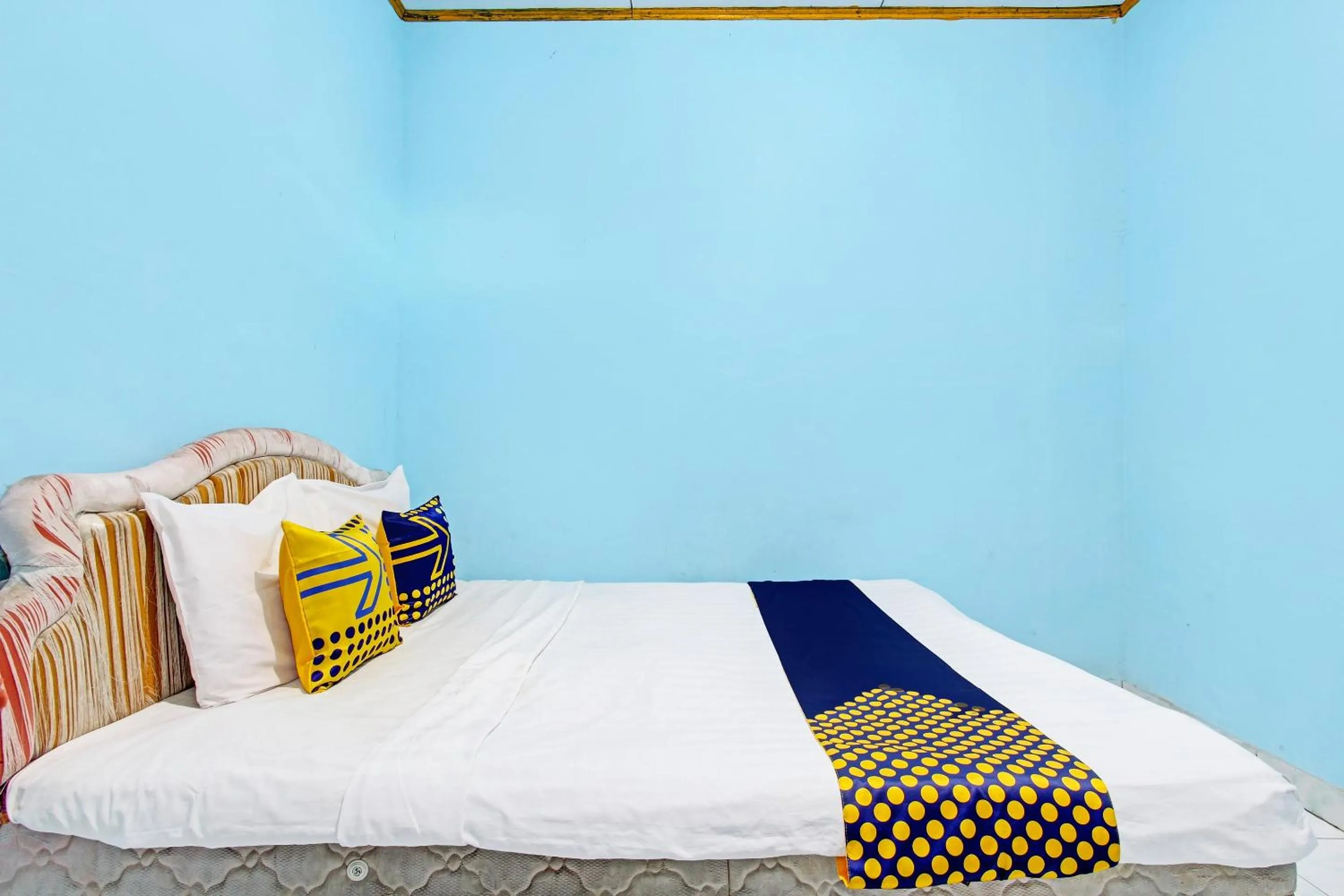 Bedroom in SPOT ON 92873 Losmen Parikesit