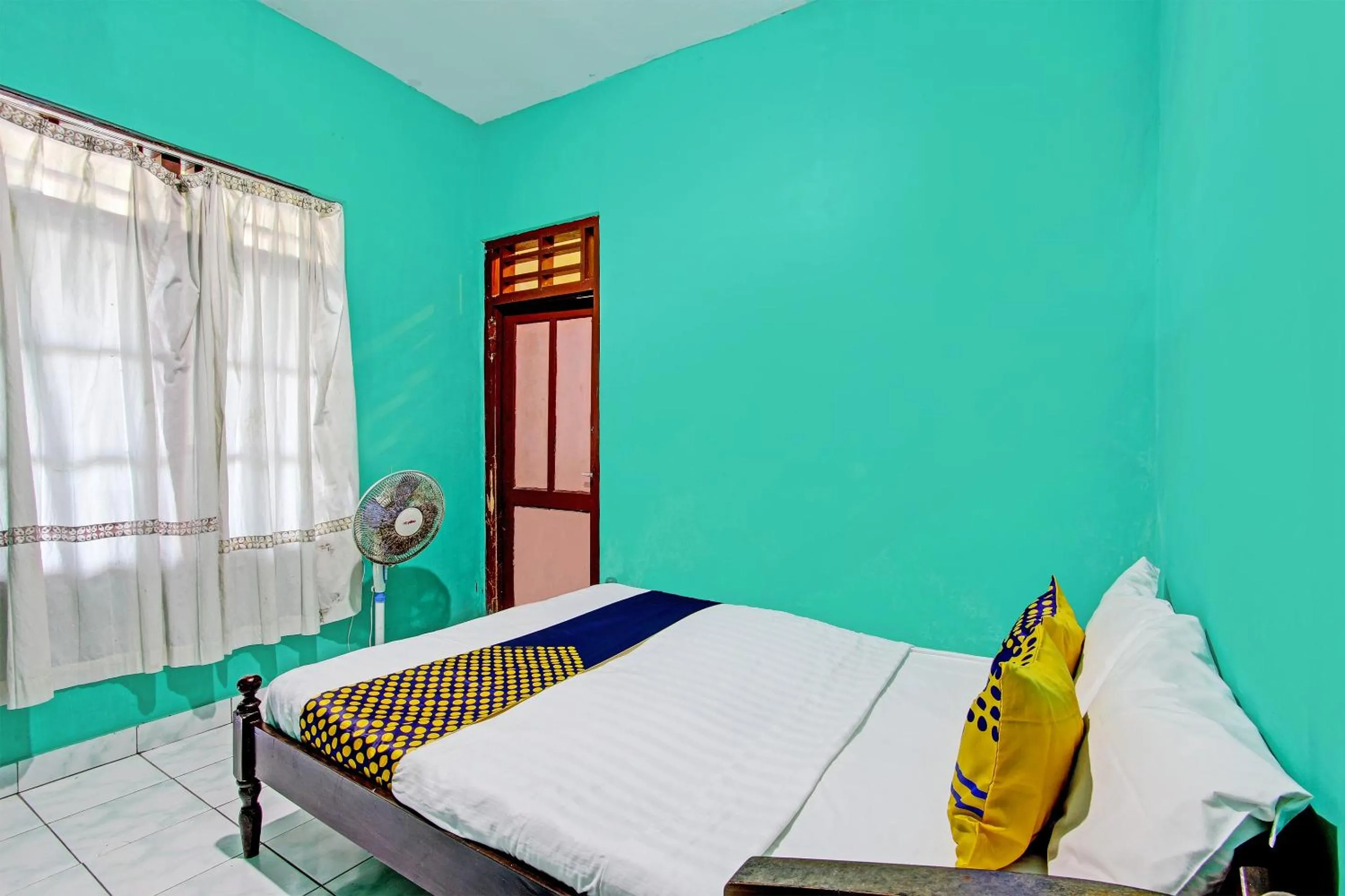 Bedroom in SPOT ON 92873 Losmen Parikesit