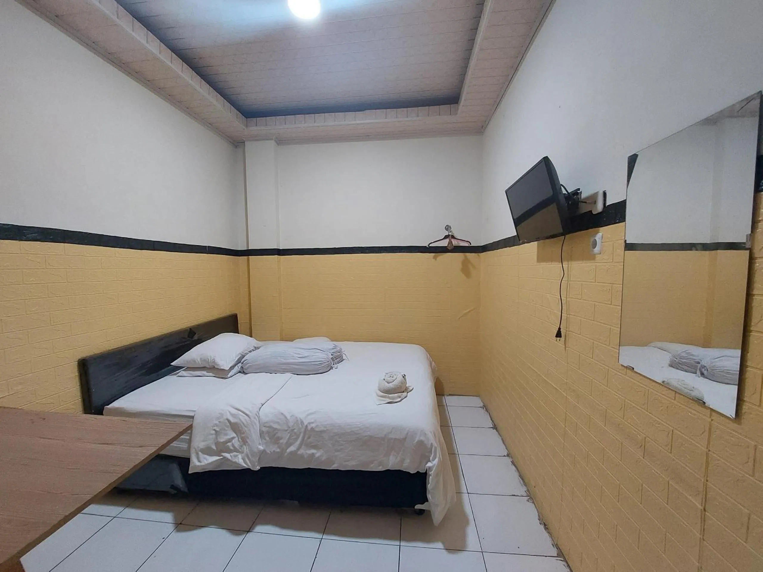 Bedroom, Bed in Hotel O Mahendra HomestayNearTaman Wisata Bukit Rurukan