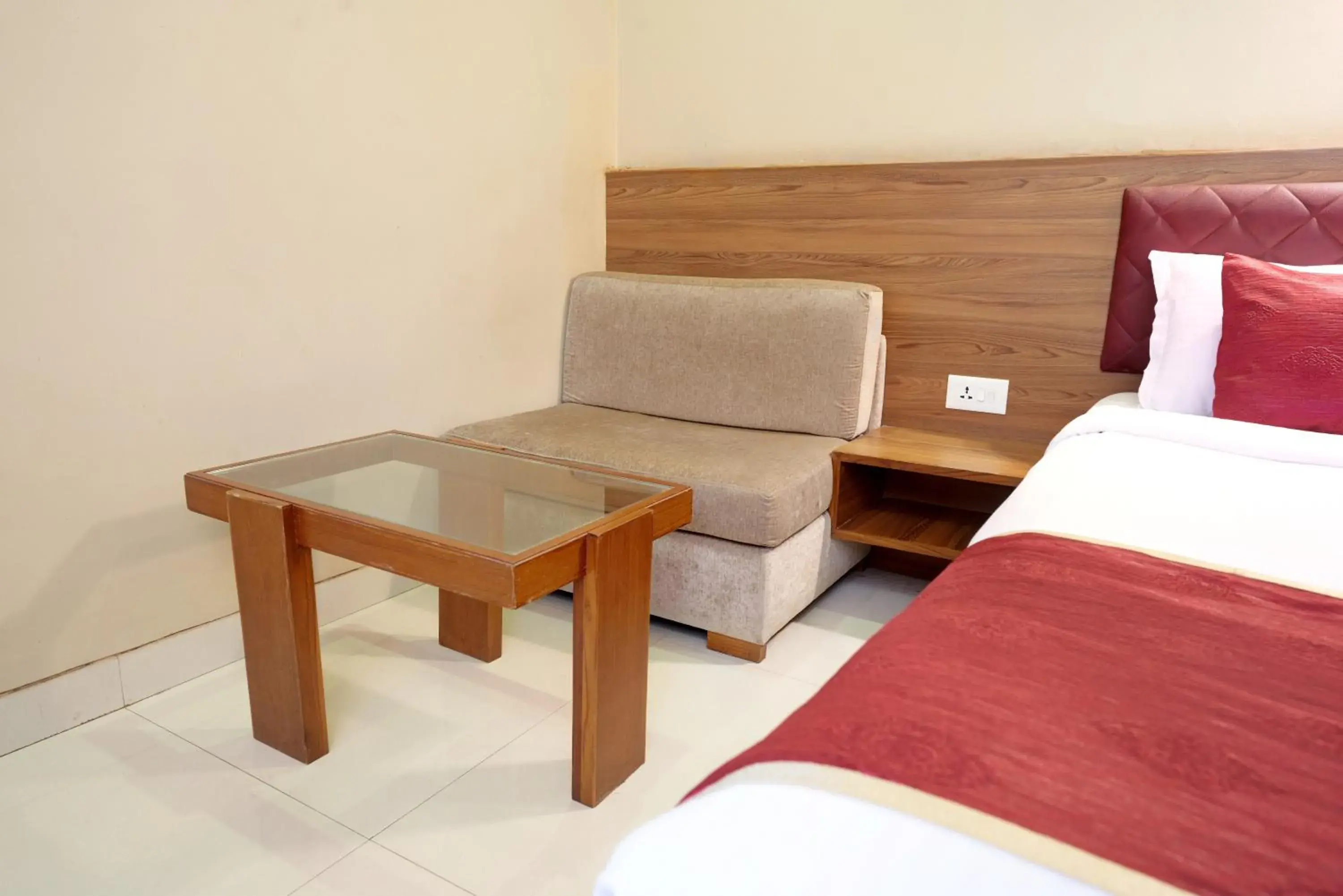 Seating area, Bed in Hotel Prestige, Mangalore Seating area, Bed in Hotel Prestige, Mangalore