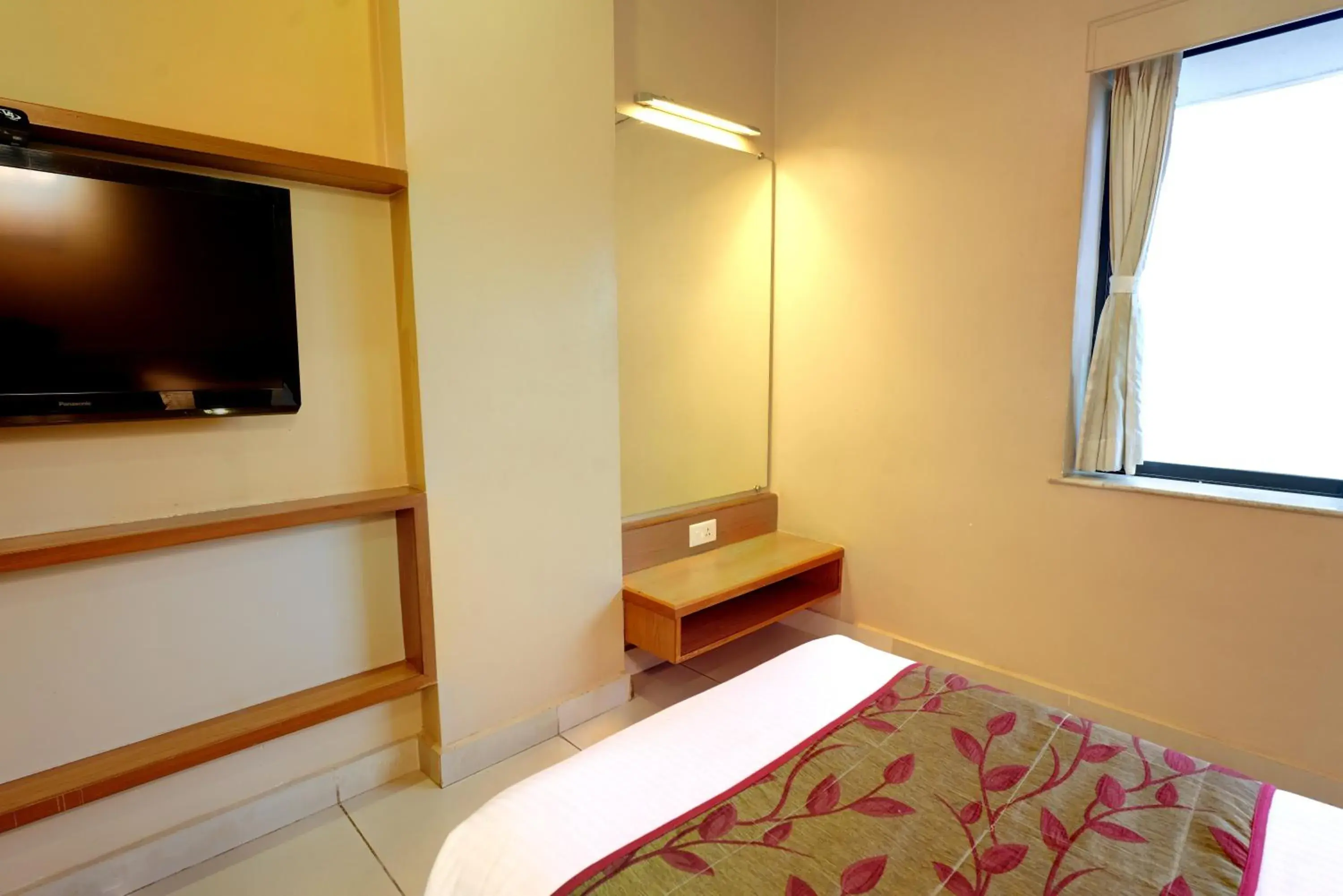 TV and multimedia, Bed in Hotel Prestige, Mangalore TV and multimedia, Bed in Hotel Prestige, Mangalore