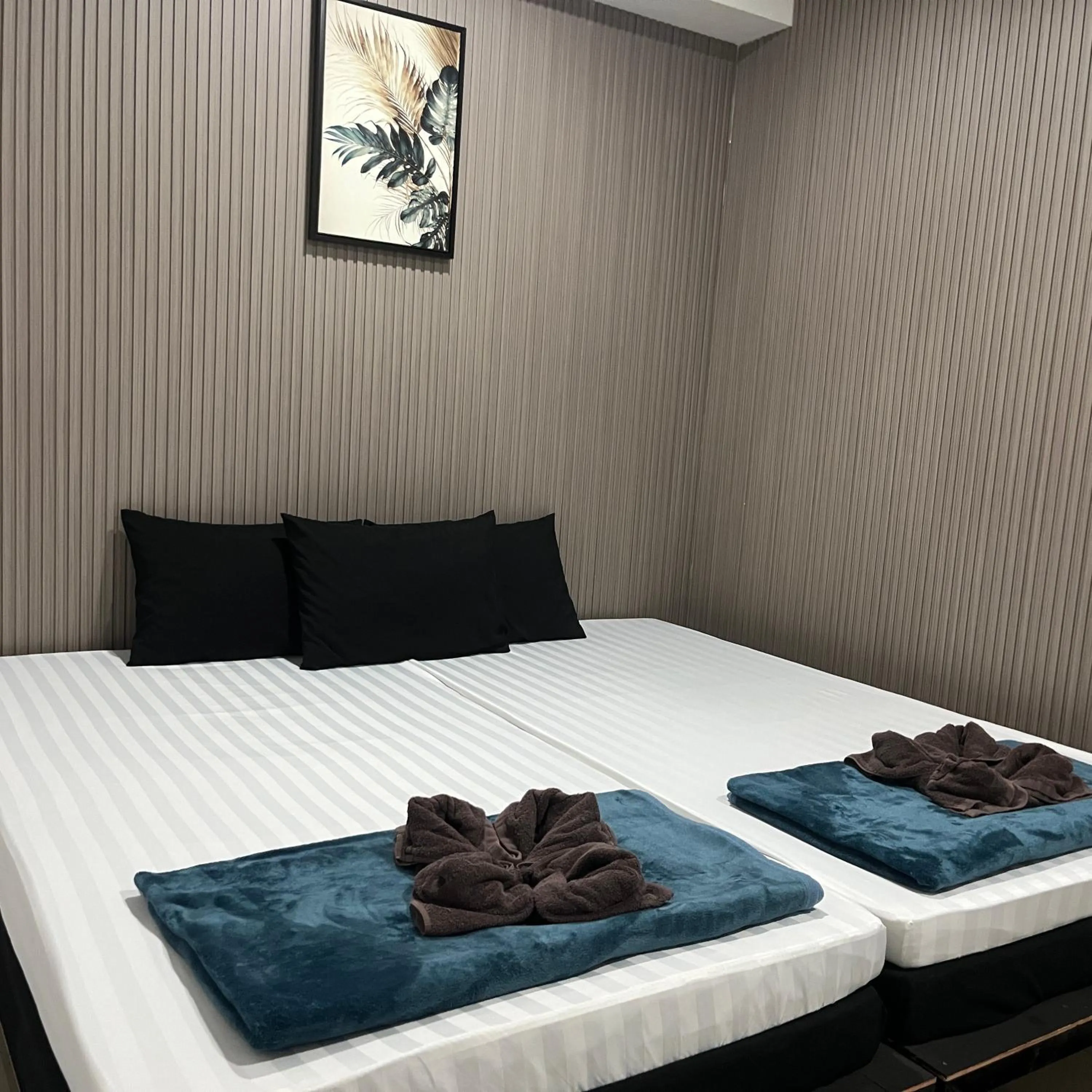 Bed in DonMueang station hotel