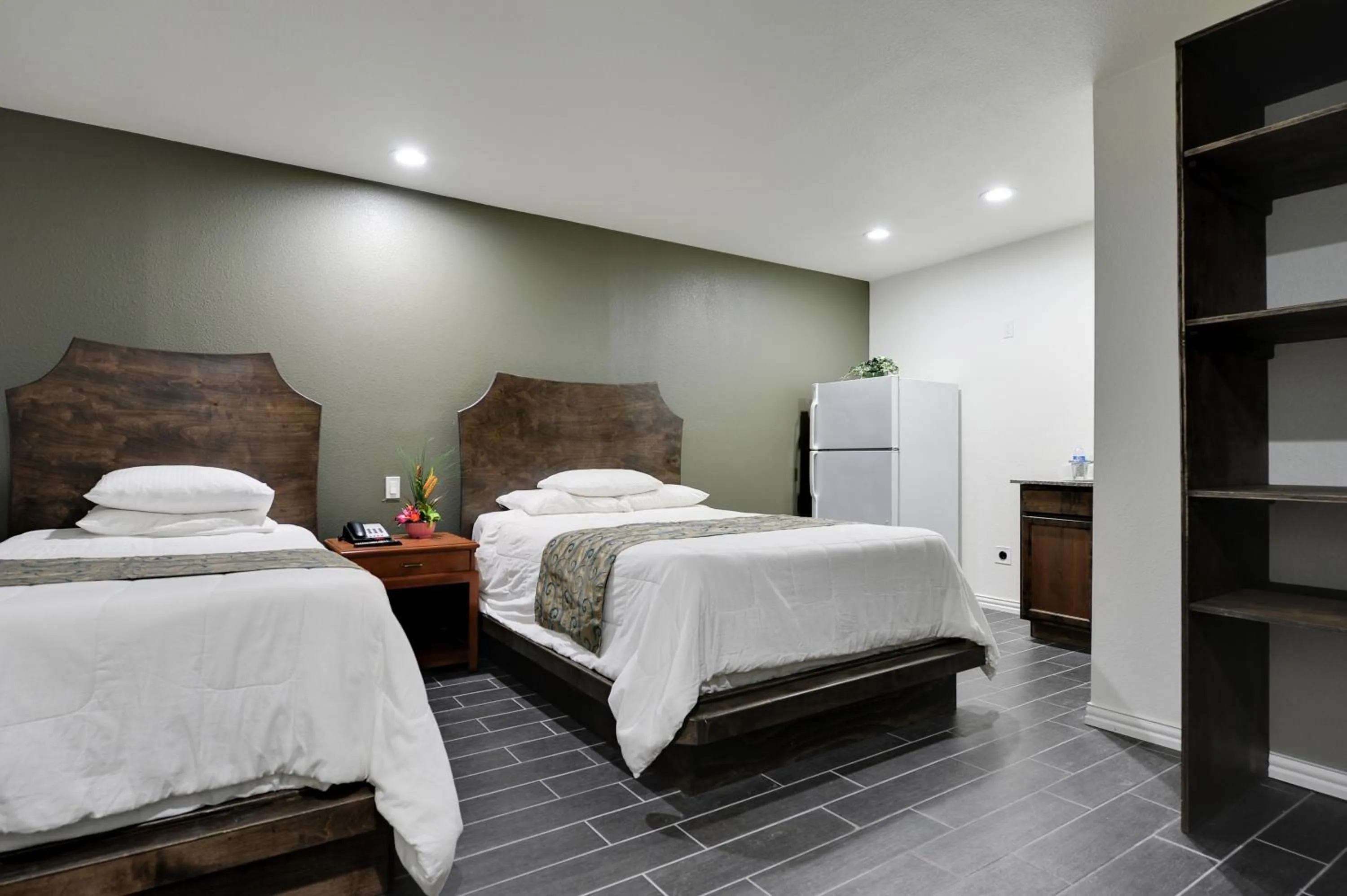 Kitchen or kitchenette, Bed in Romantic Inn & Suites