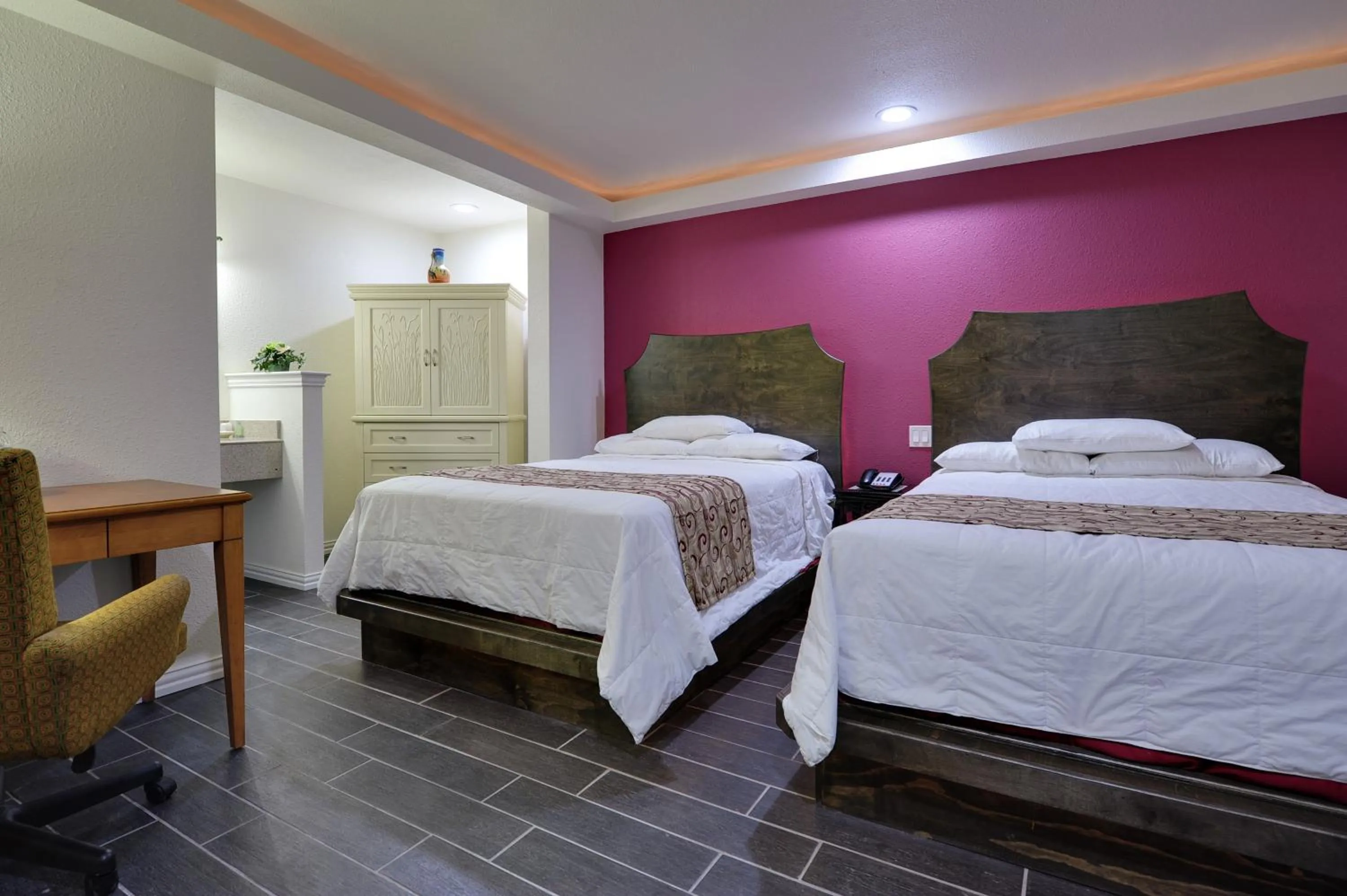 Bed in Romantic Inn & Suites