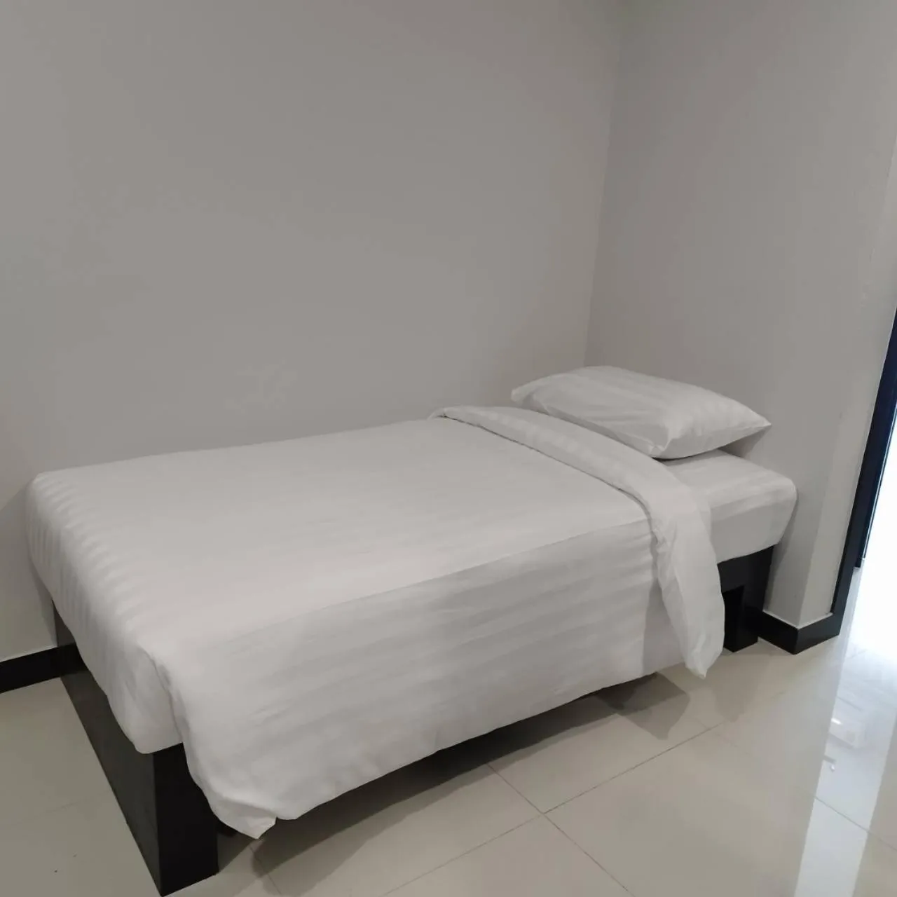 Bed in LHC HOTEL AND RESORT