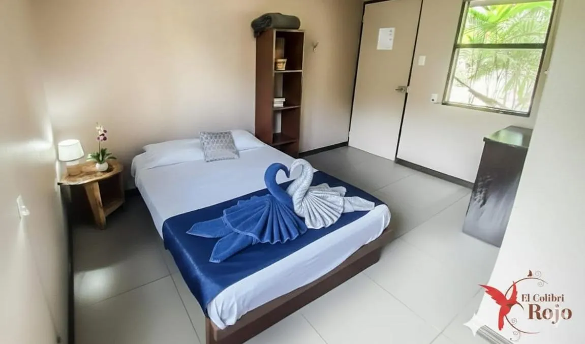 Bed in Hotel El Colibri Rojo