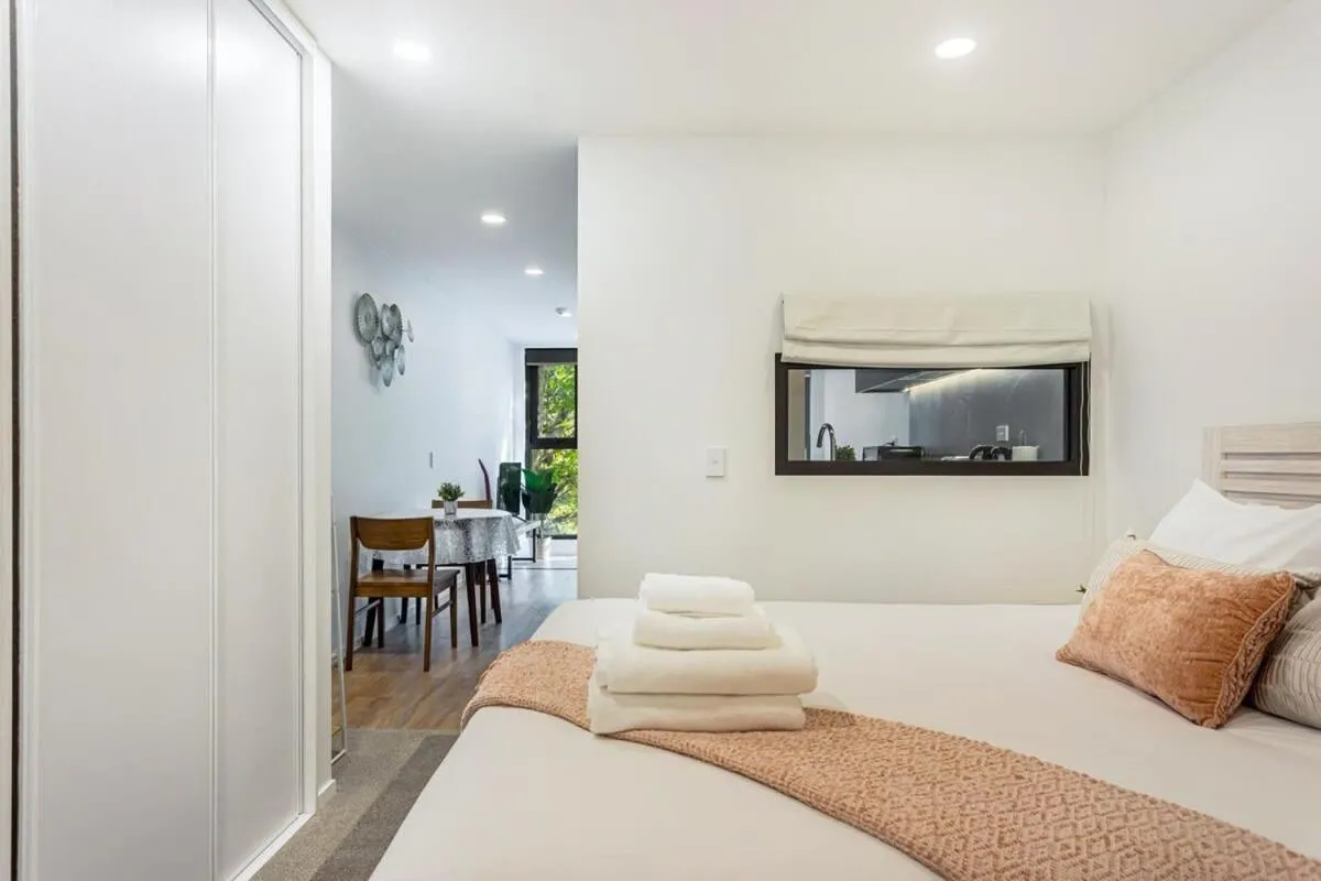 Bed in Sunny 1BR Retreat in Heart of CBD by Zodiak Stays