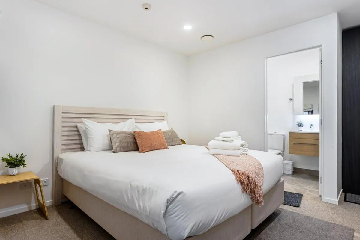 Bed in Sunny 1BR Retreat in Heart of CBD by Zodiak Stays