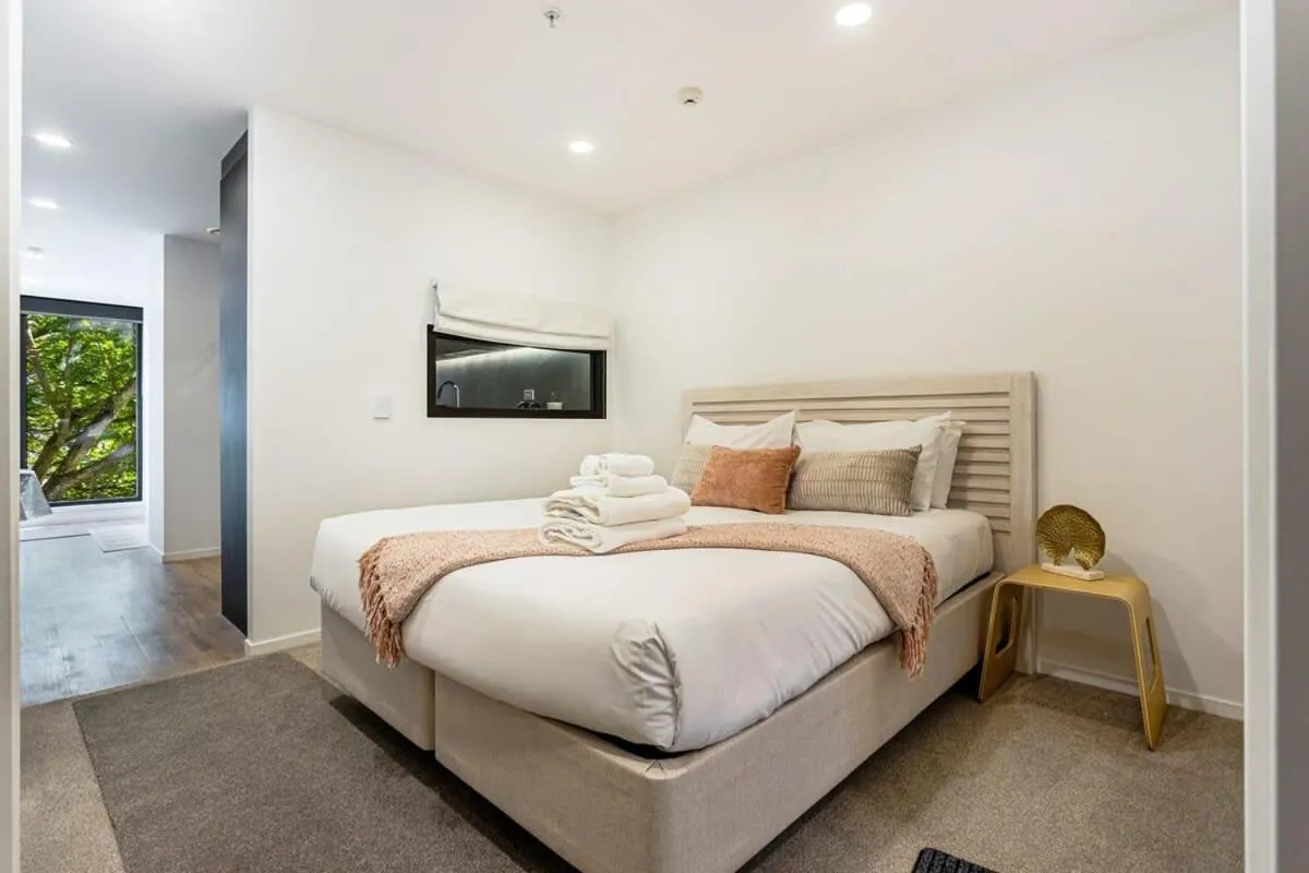 Bed in Sunny 1BR Retreat in Heart of CBD by Zodiak Stays