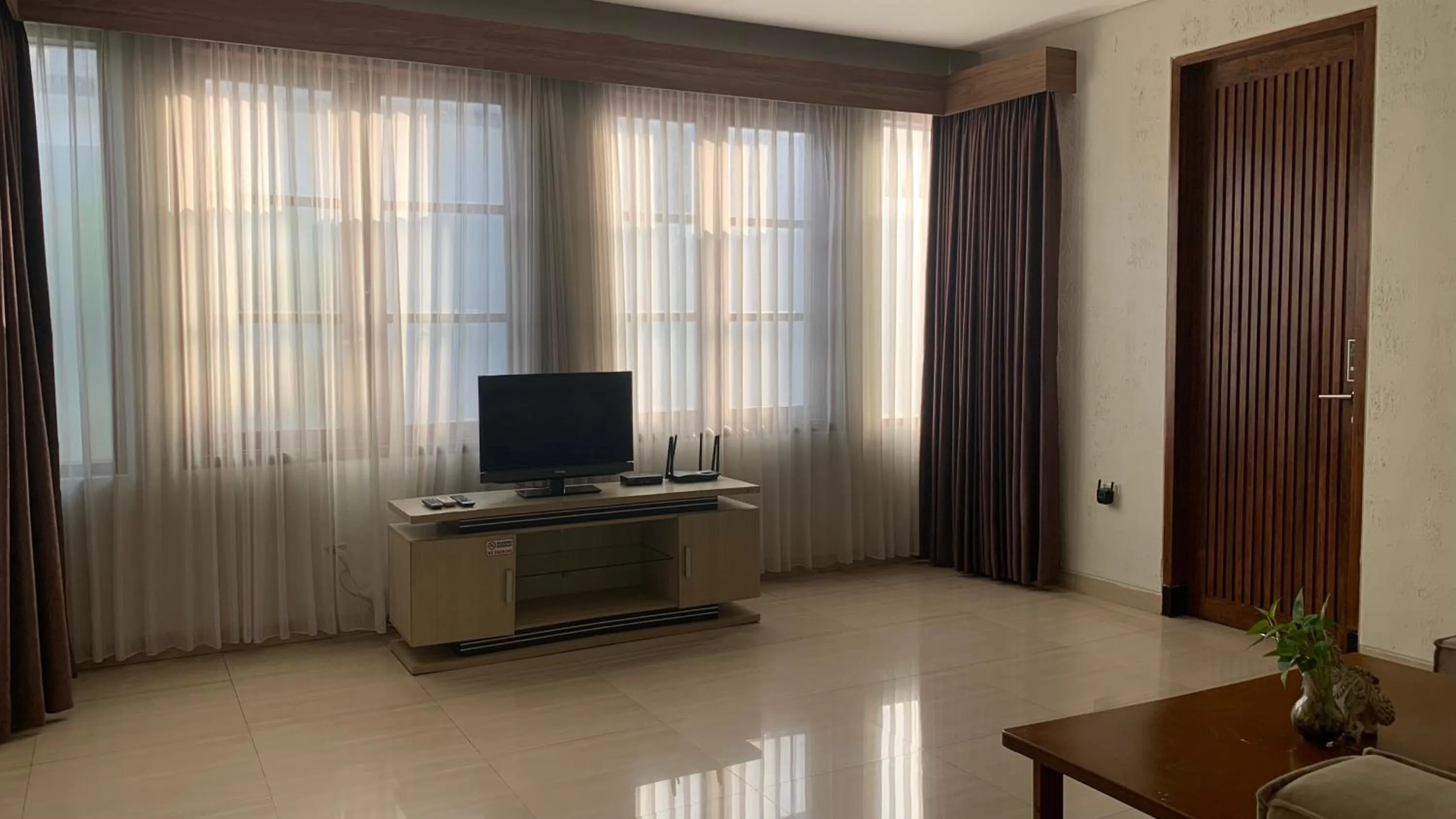 Communal lounge/ TV room in The BALIem Villa