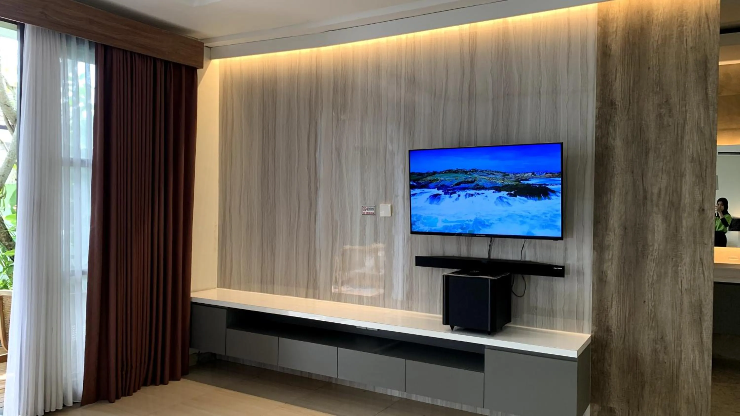 Communal lounge/ TV room in The BALIem Villa