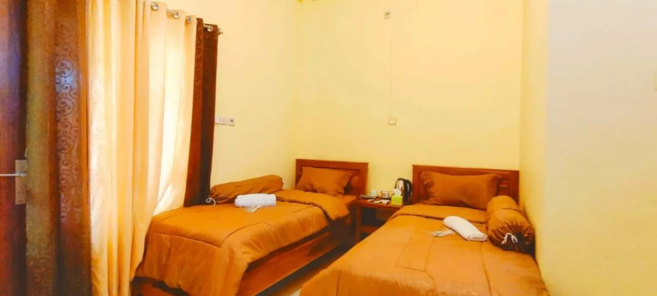 Bed in FIFAWIND HOTEL