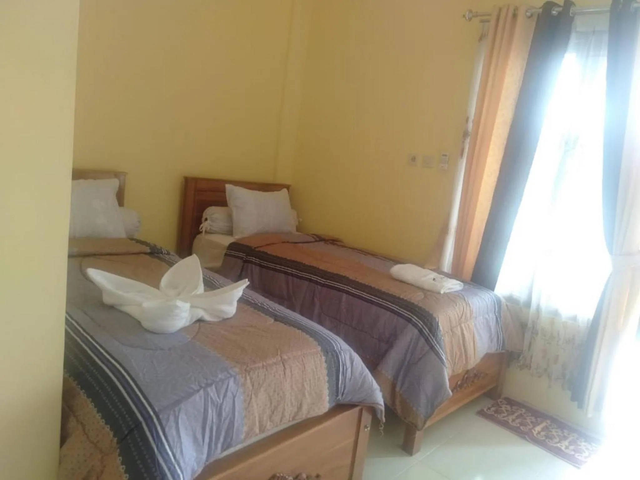 Bed in FIFAWIND HOTEL