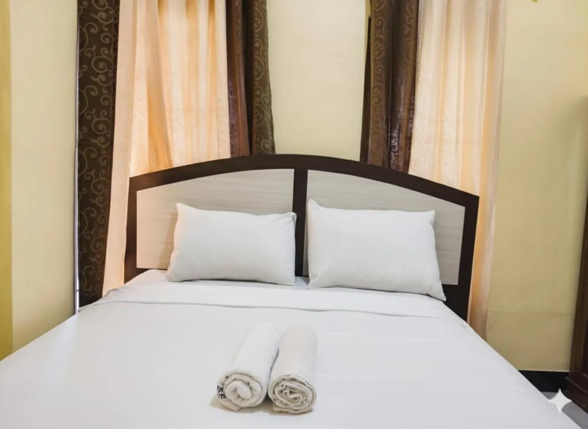 Bed in FIFAWIND HOTEL