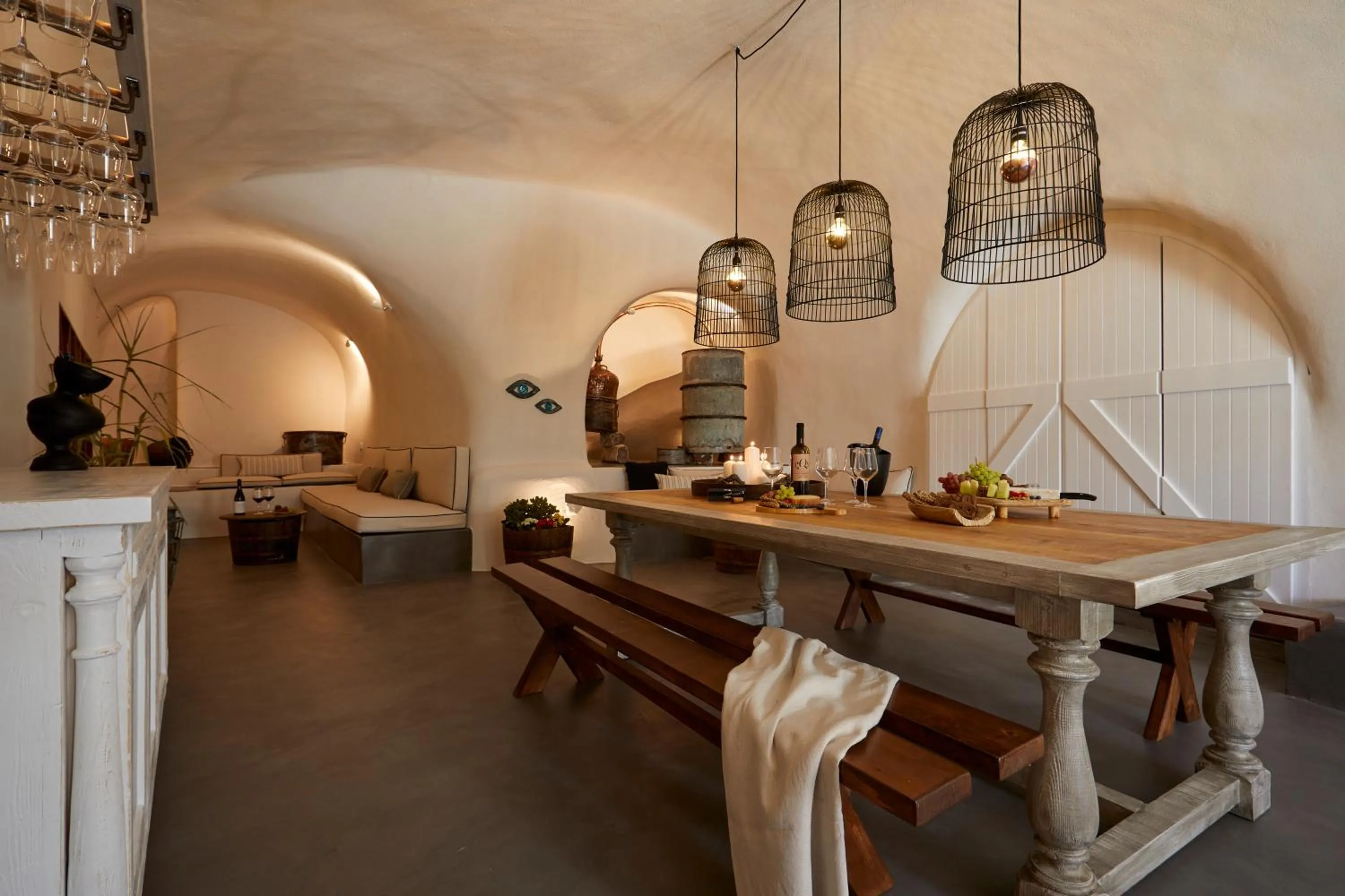Communal lounge/ TV room in Arxegono Cave Houses Santorini