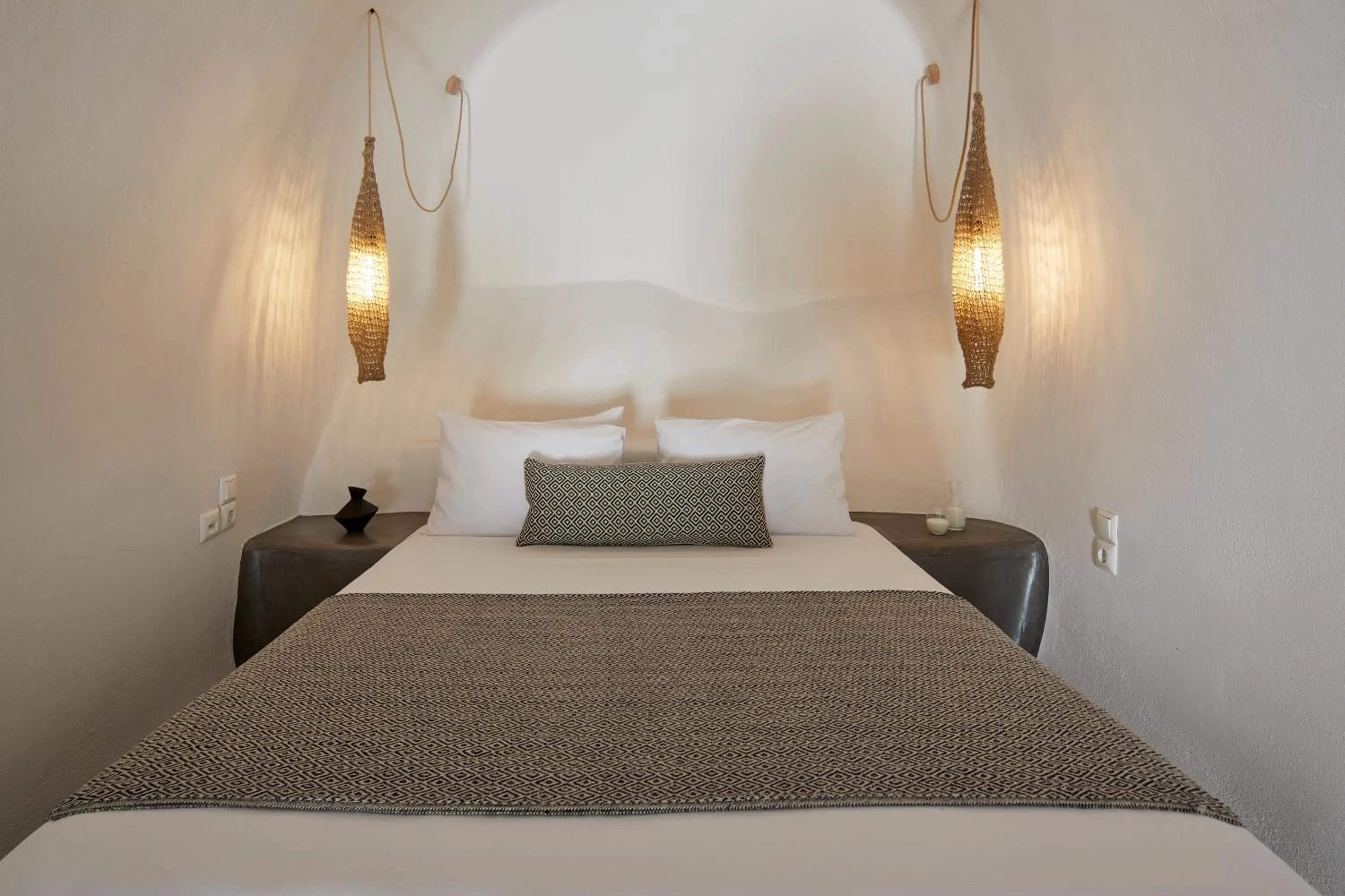 Bed in Arxegono Cave Houses Santorini