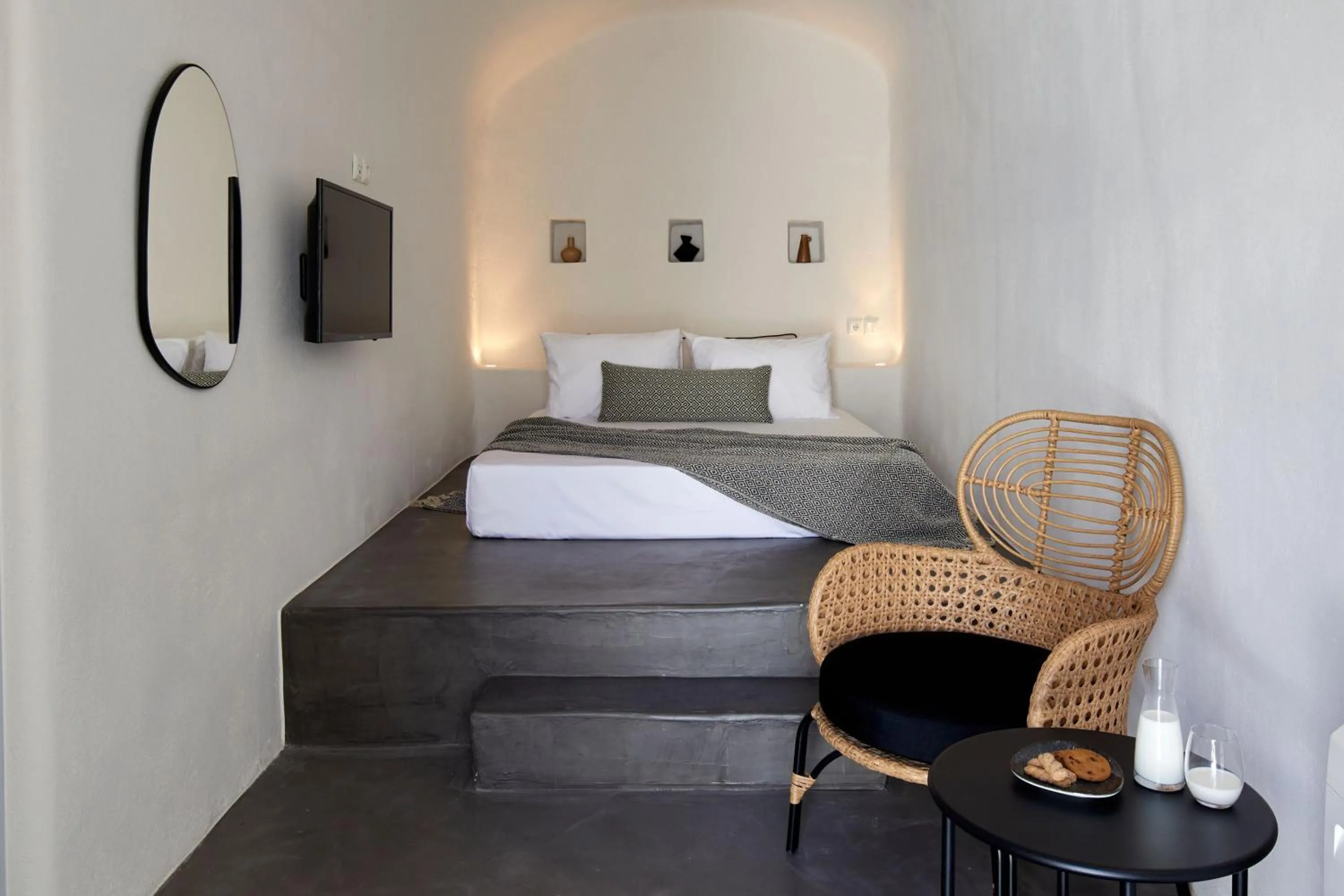 Bed in Arxegono Cave Houses Santorini