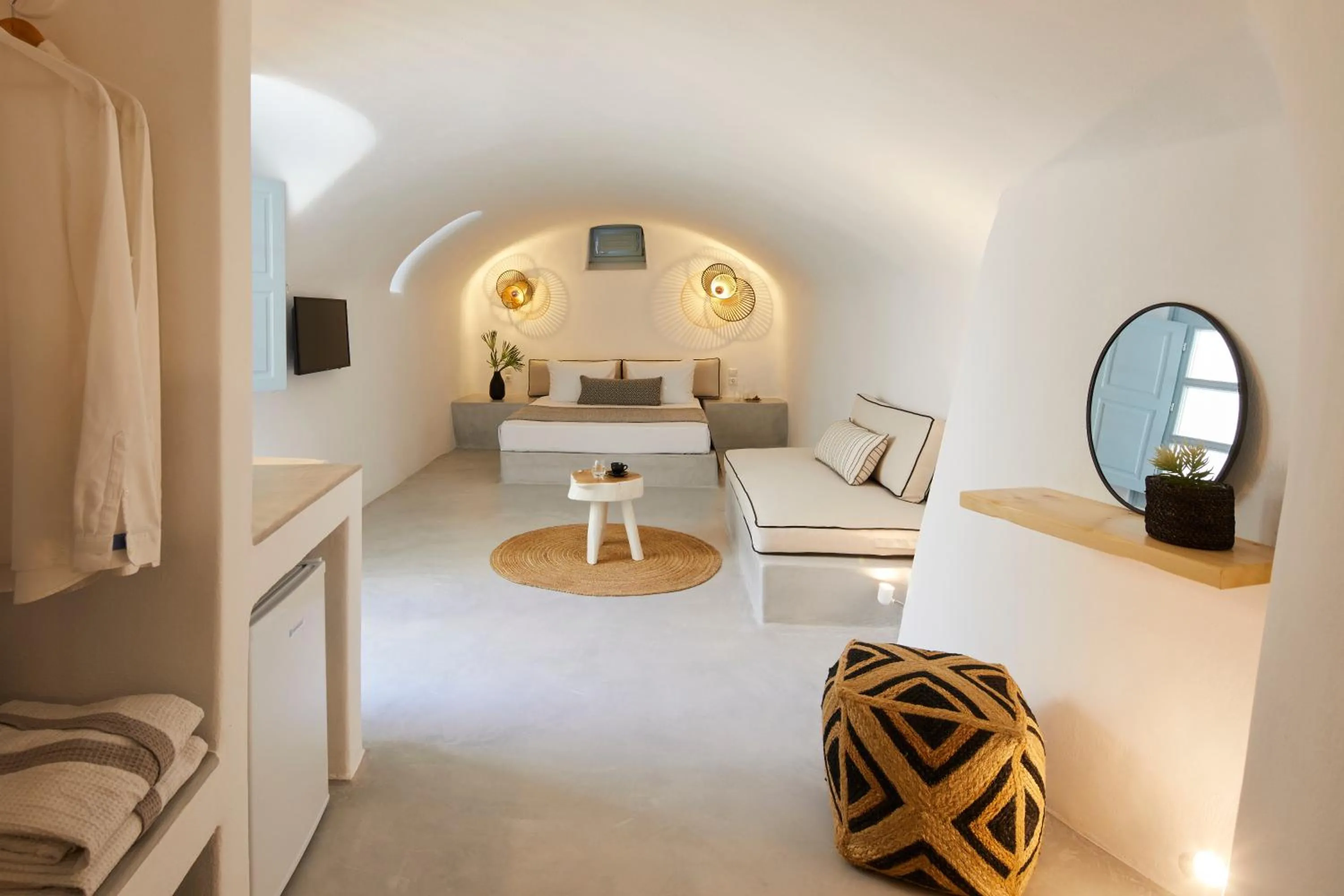 Bed in Arxegono Cave Houses Santorini