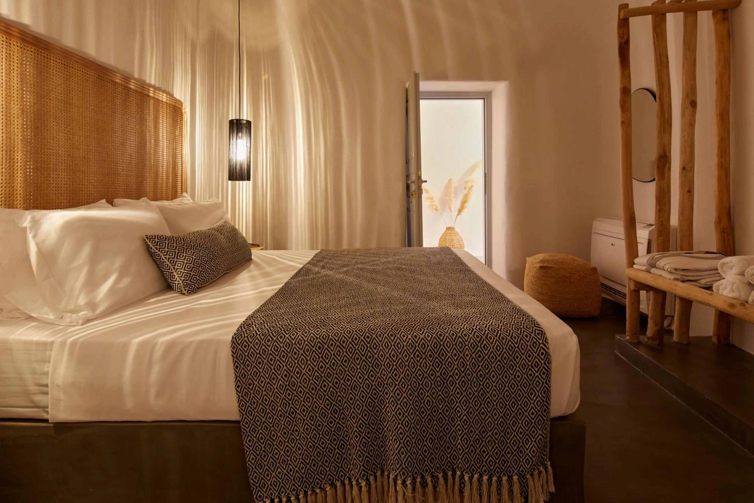 Bed in Arxegono Cave Houses Santorini