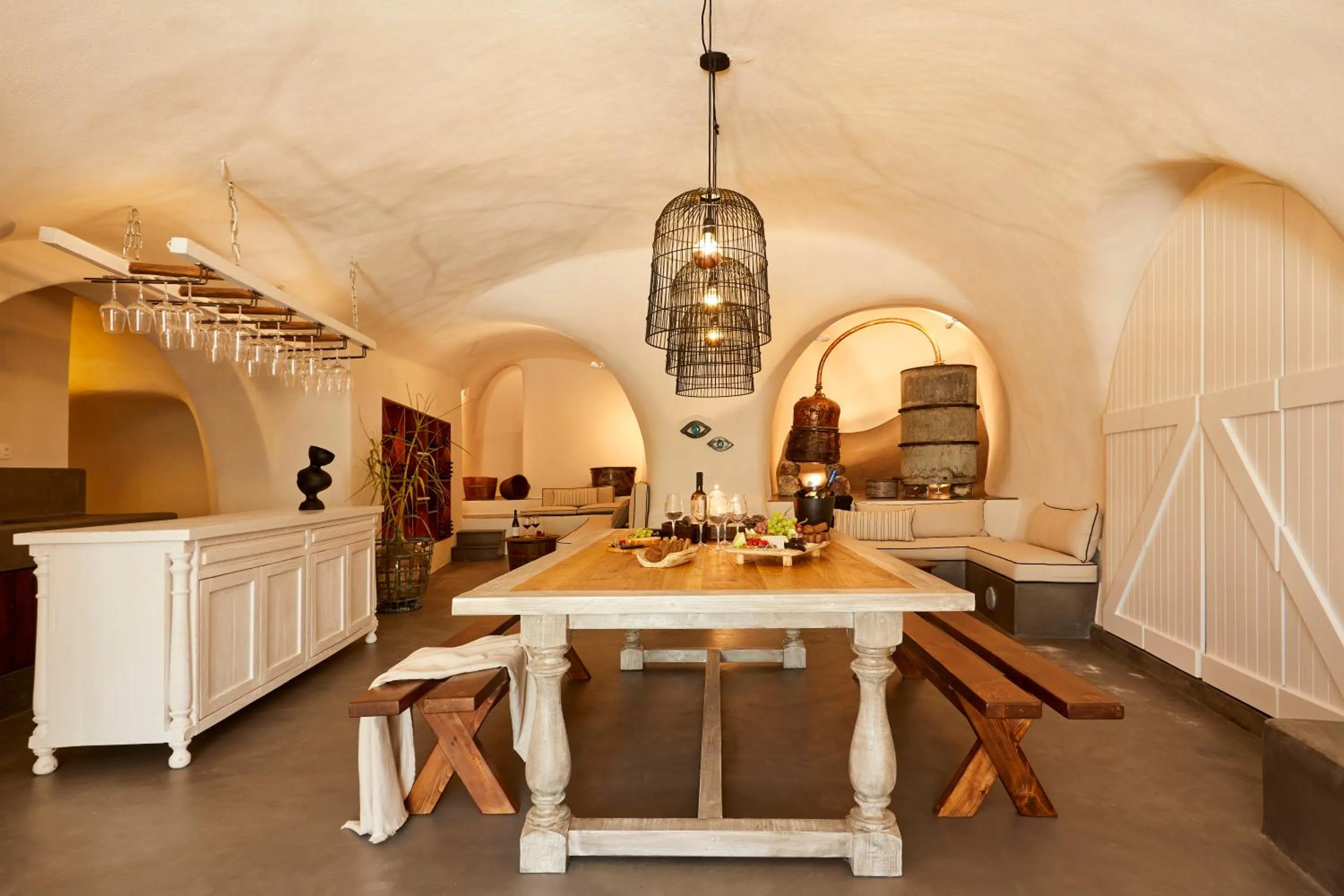 Communal lounge/ TV room in Arxegono Cave Houses Santorini