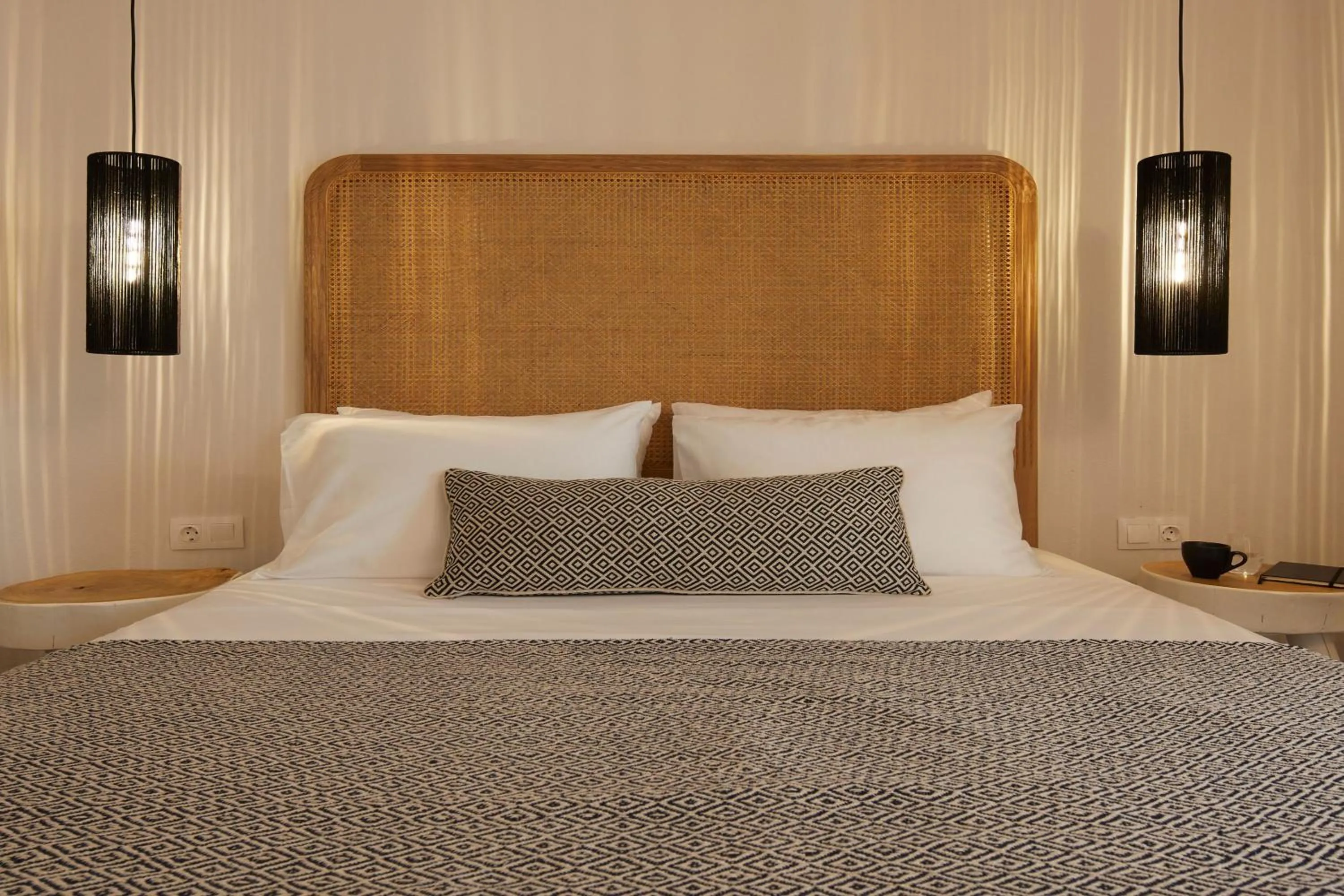 Bed in Arxegono Cave Houses Santorini