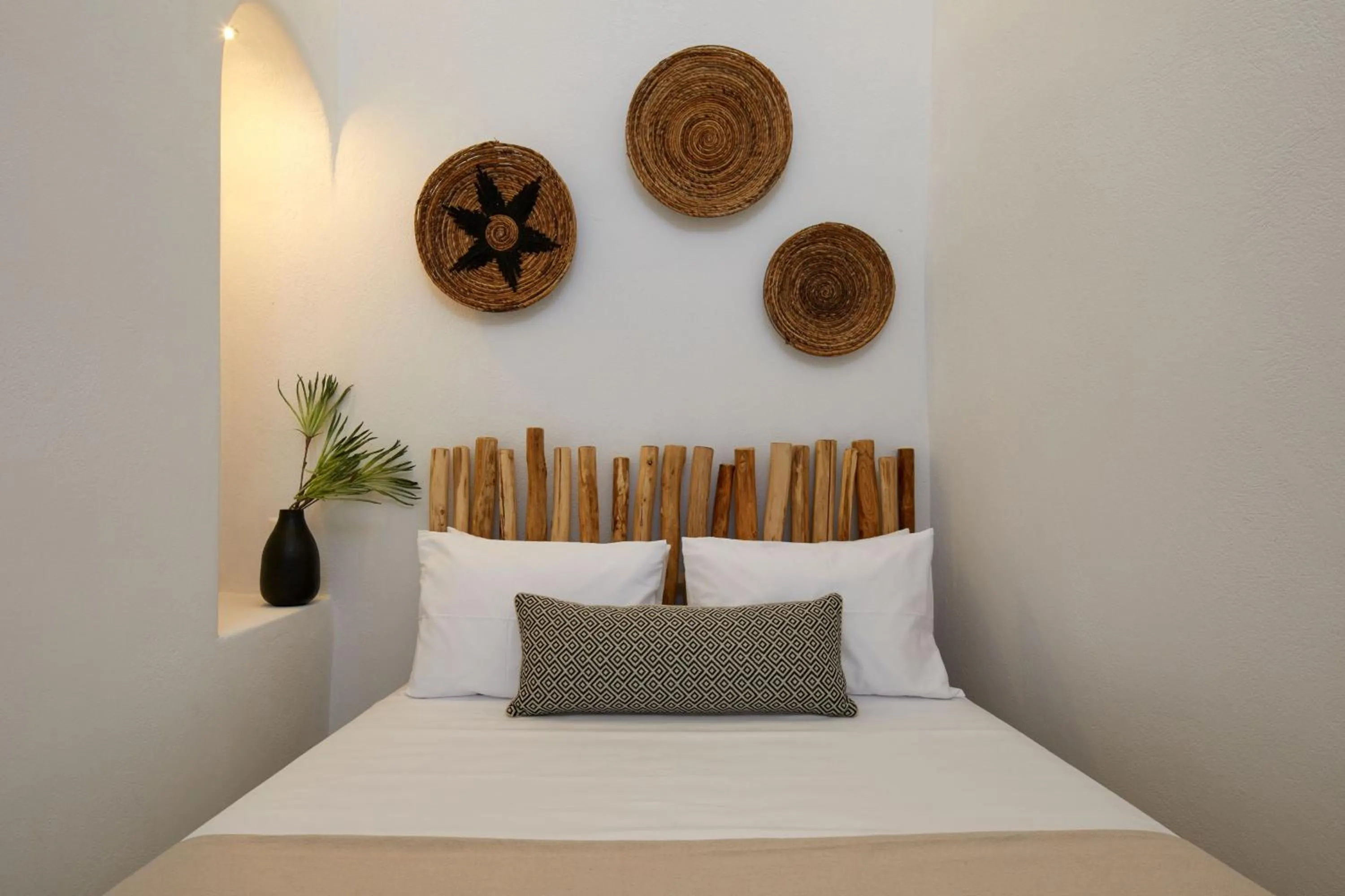 Bed in Arxegono Cave Houses Santorini