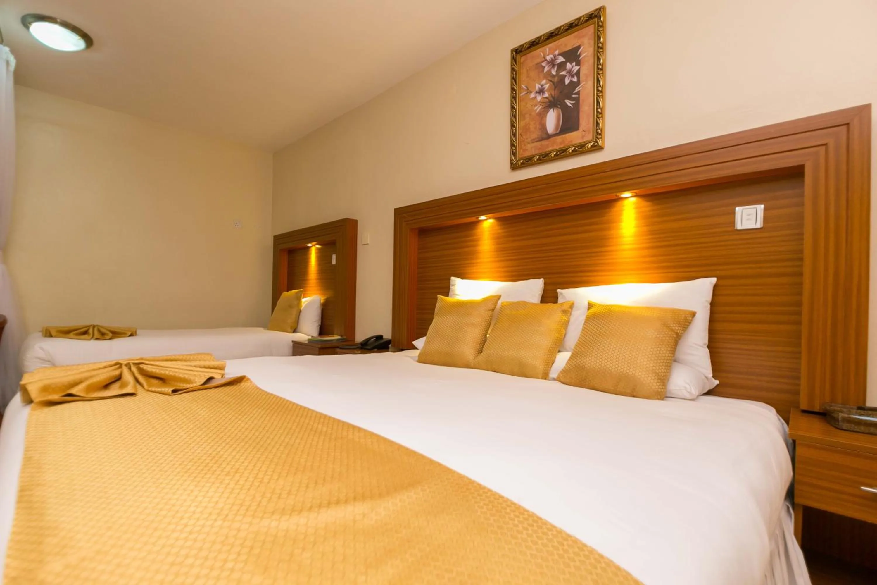 Bed in Fahari Gardens Hotel