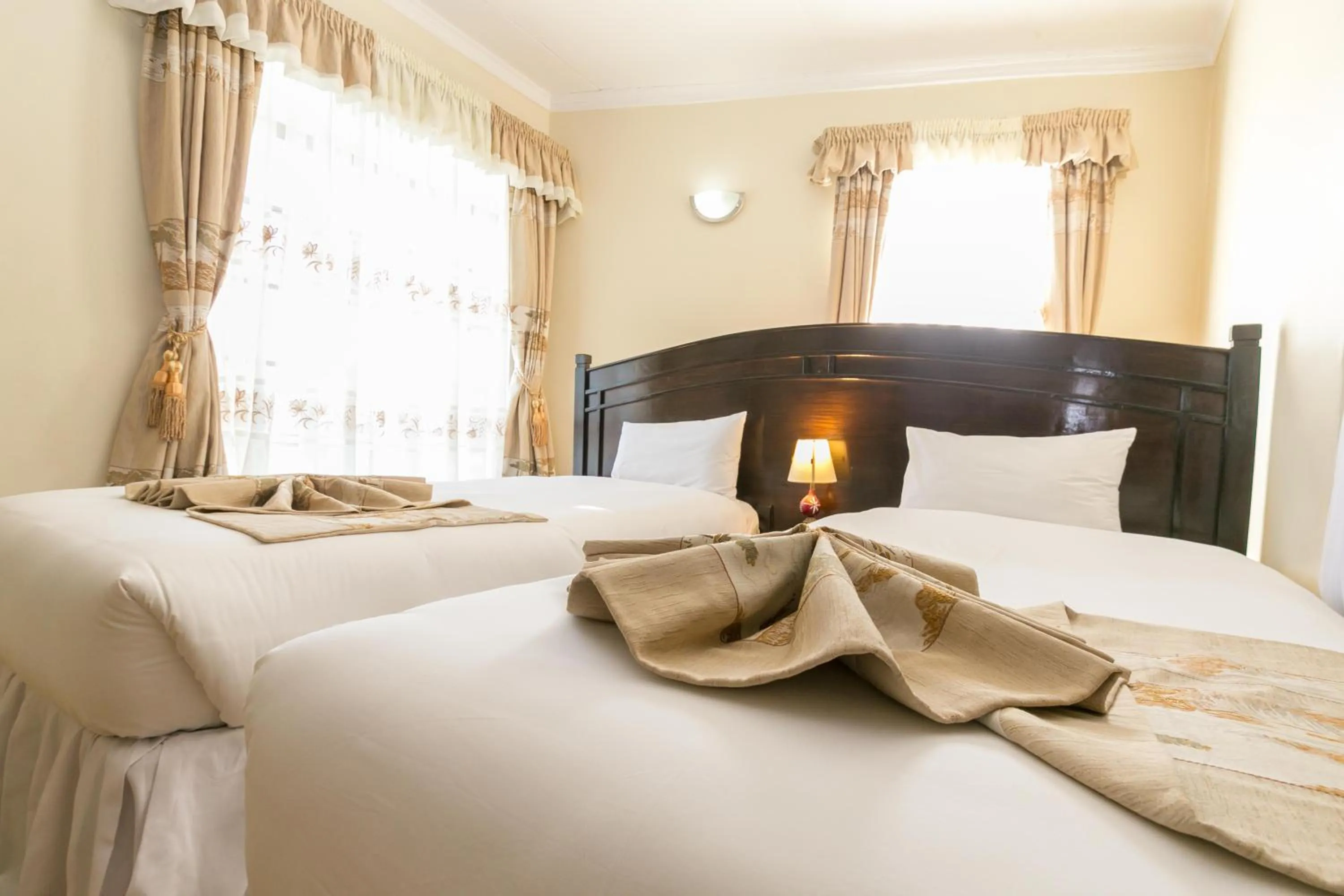 Bedroom, Bed in Fahari Gardens Hotel