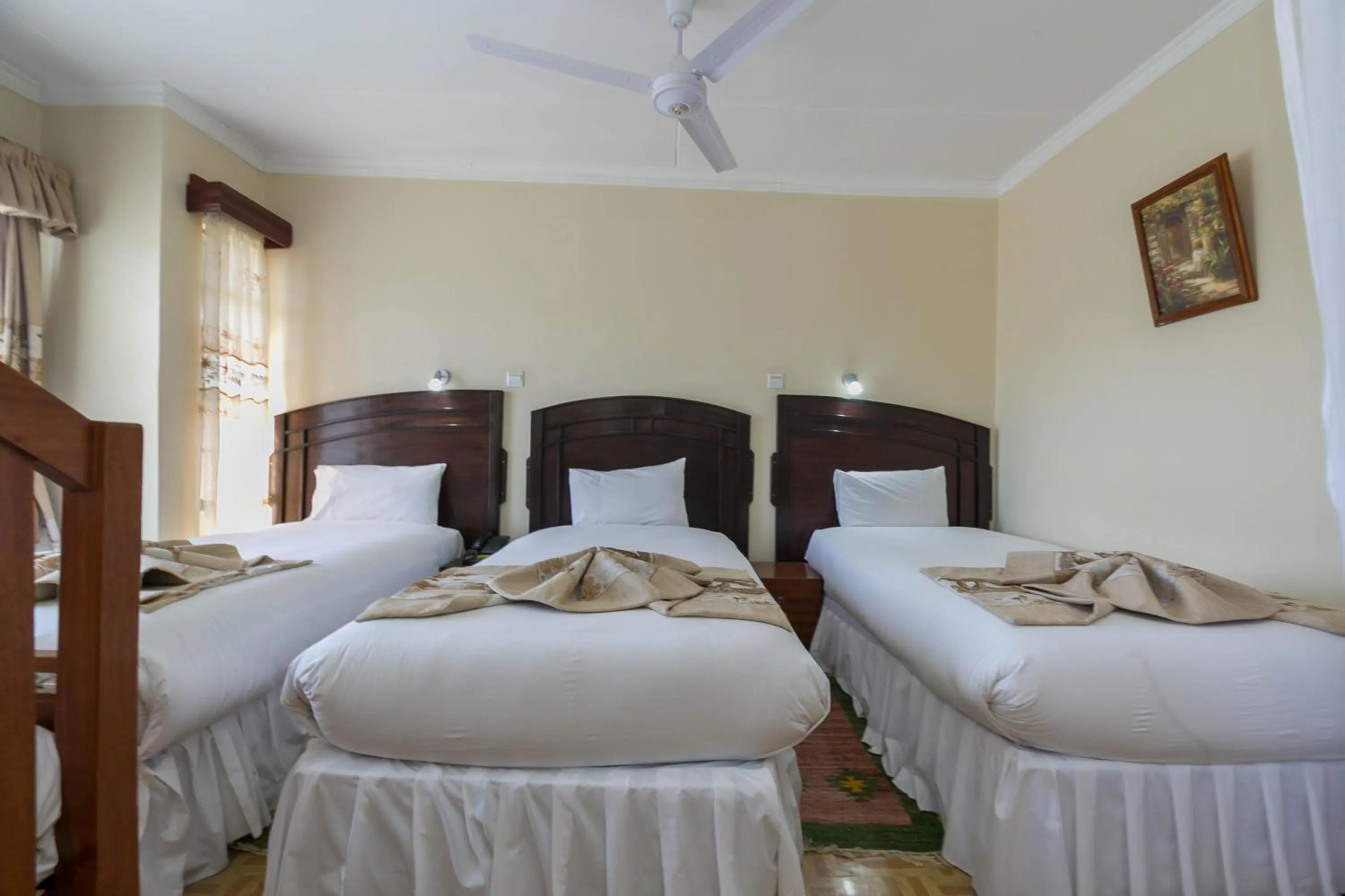 Bed in Fahari Gardens Hotel