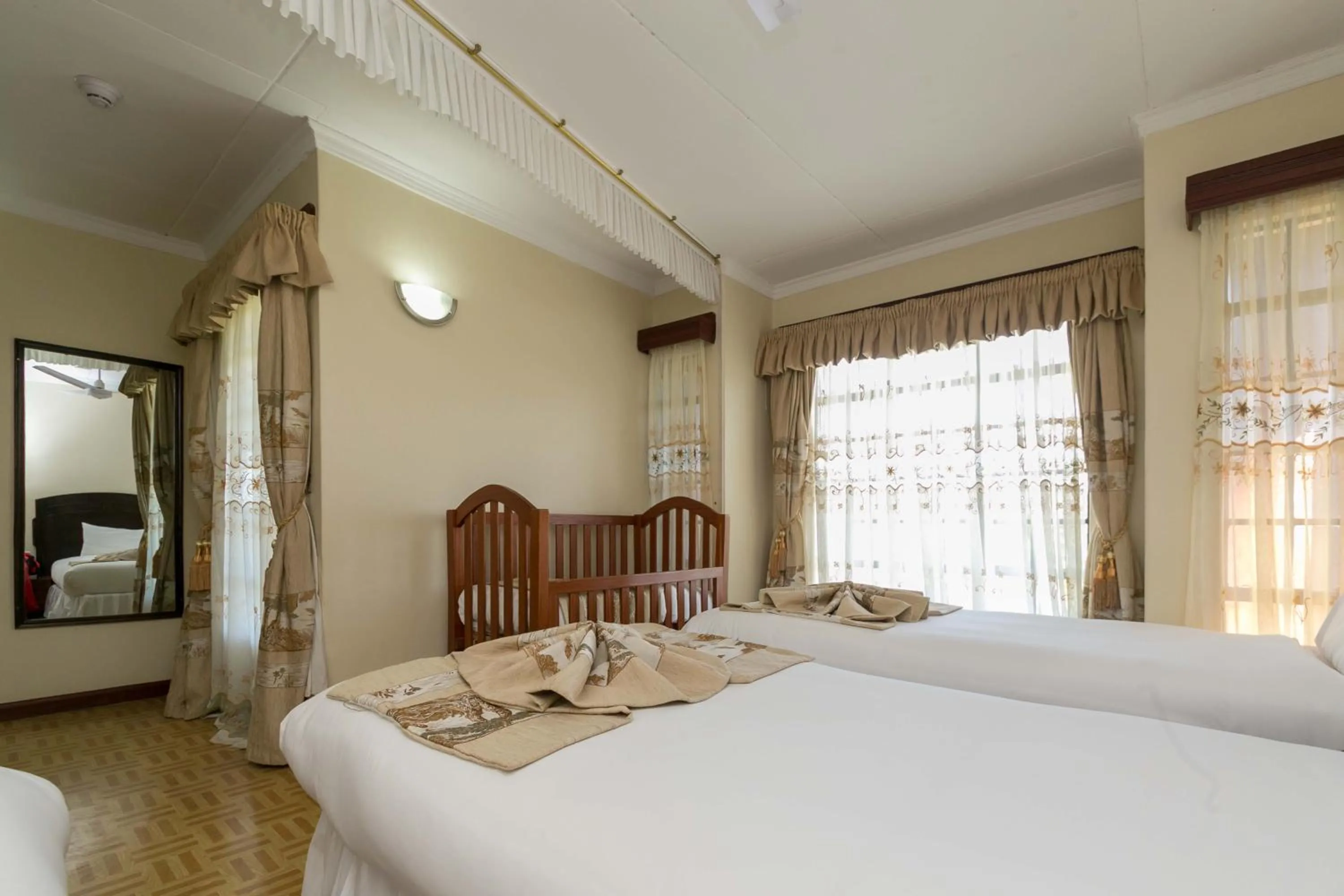 Bed in Fahari Gardens Hotel