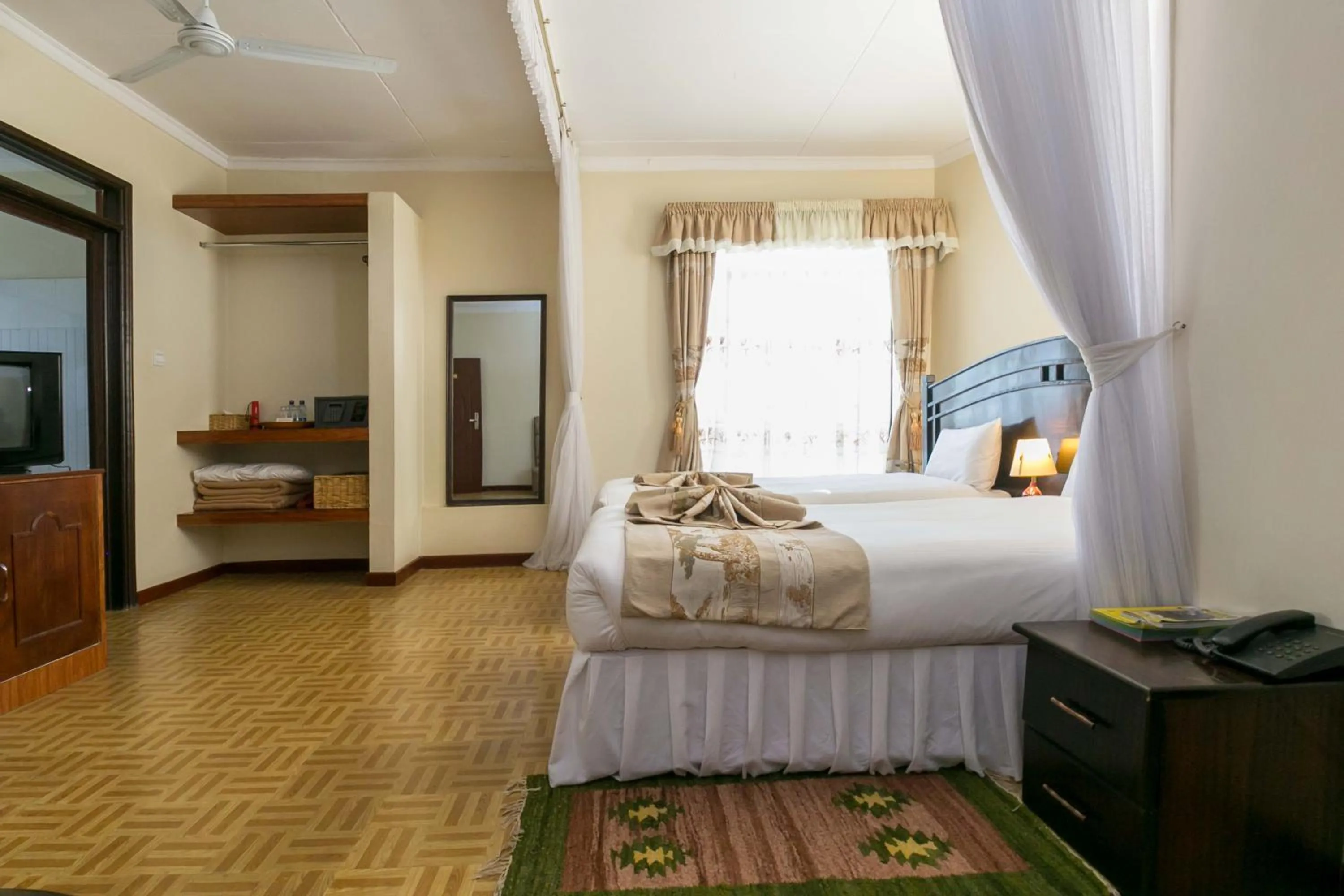 Photo of the whole room, Bed in Fahari Gardens Hotel