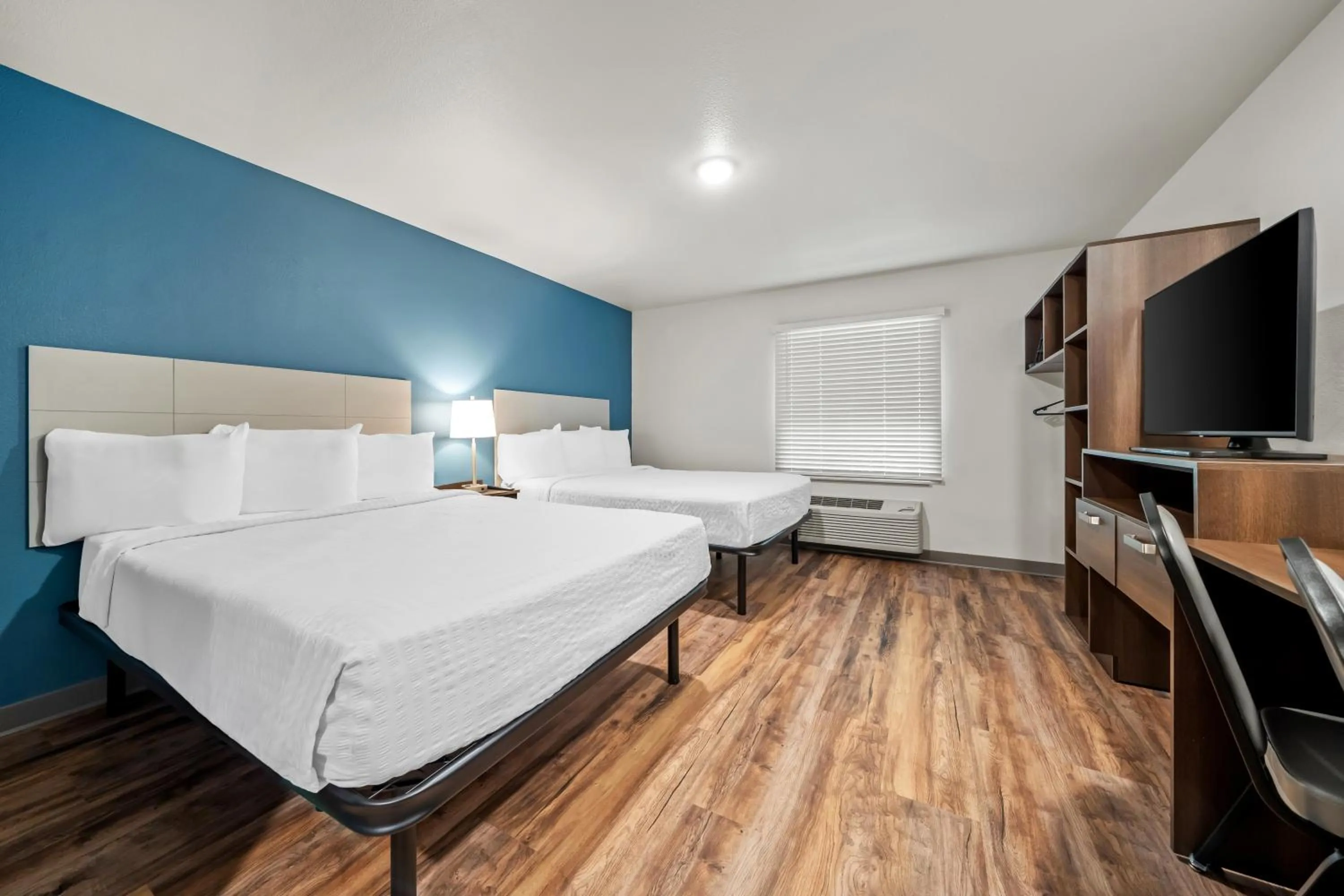 Bed in WoodSpring Suites Orlando East UCF