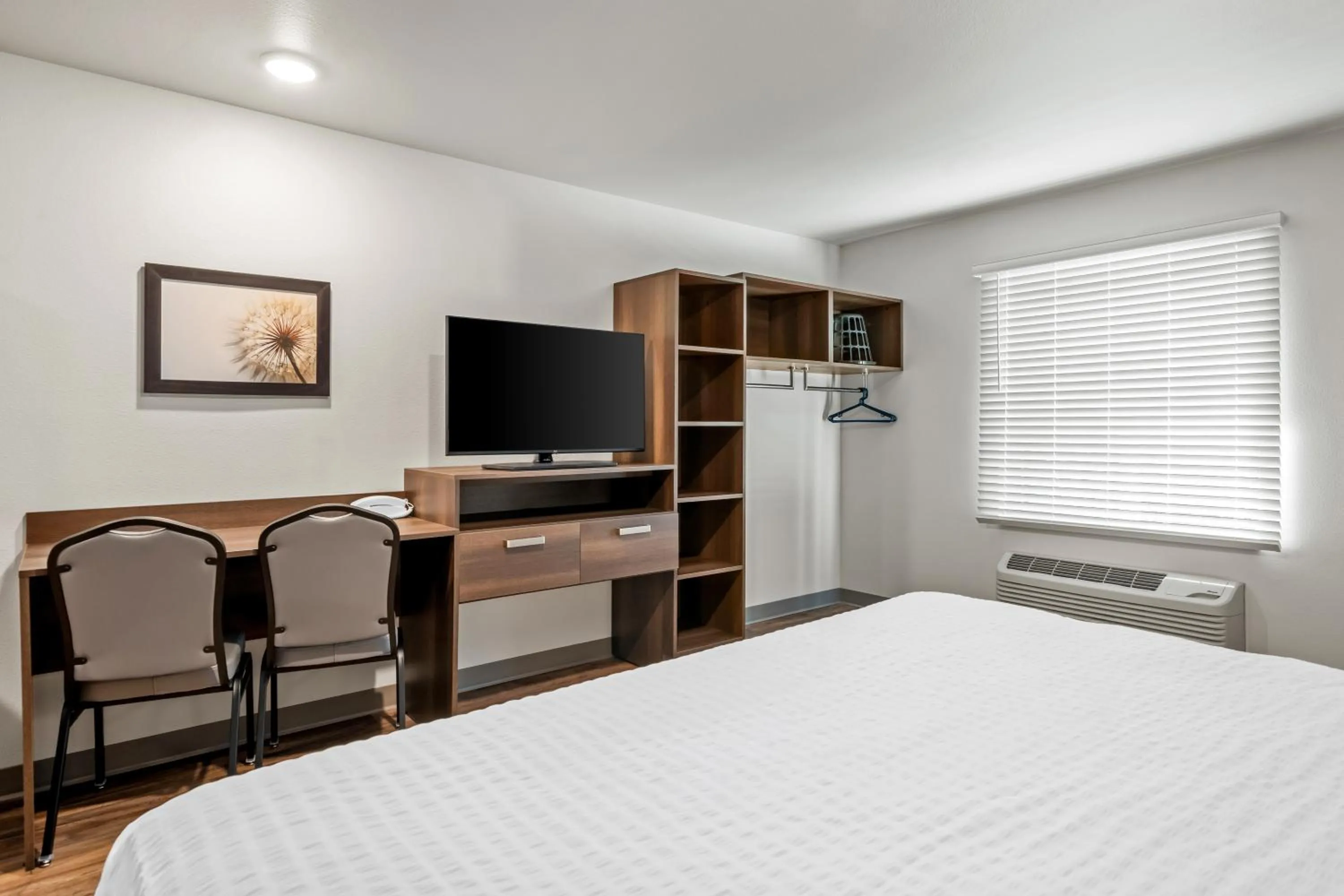 Bed in WoodSpring Suites Orlando East UCF