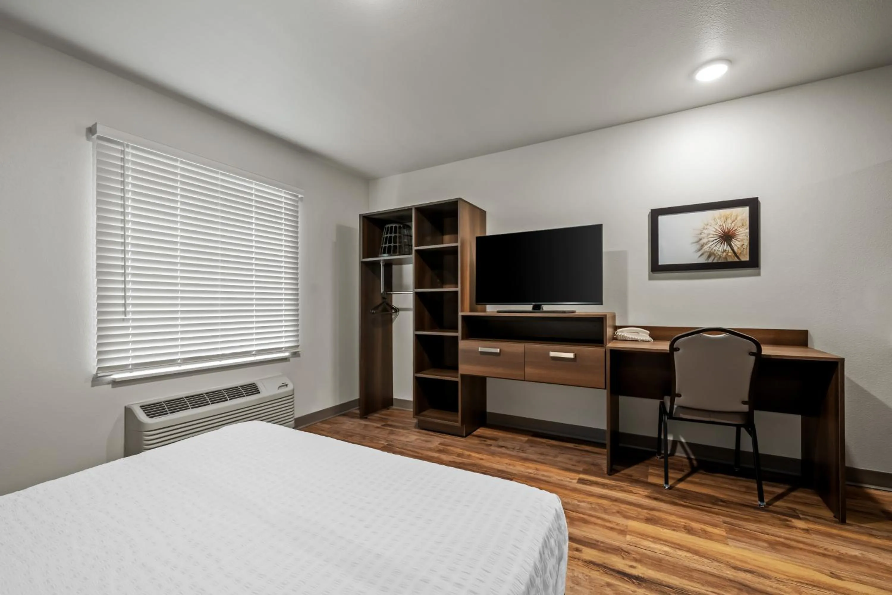 Bed in WoodSpring Suites Orlando East UCF