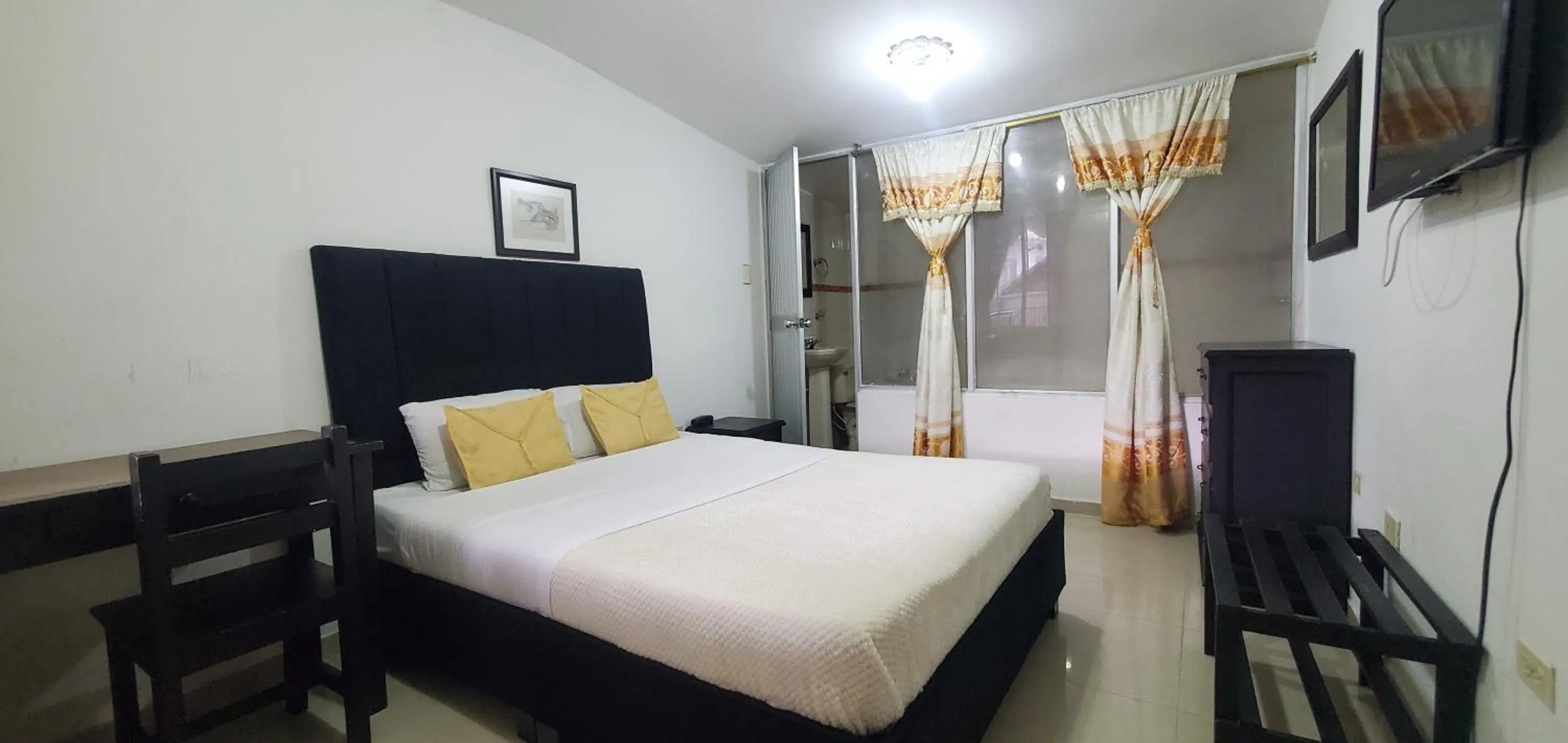 Bed in Hotel Popayan Plaza