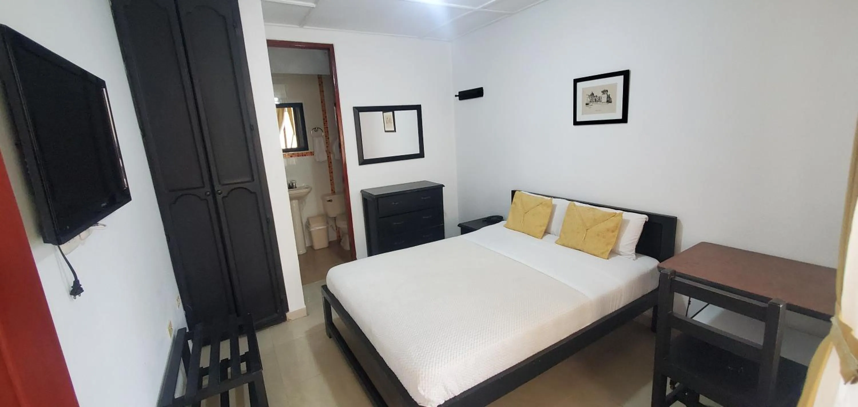 Bed in Hotel Popayan Plaza