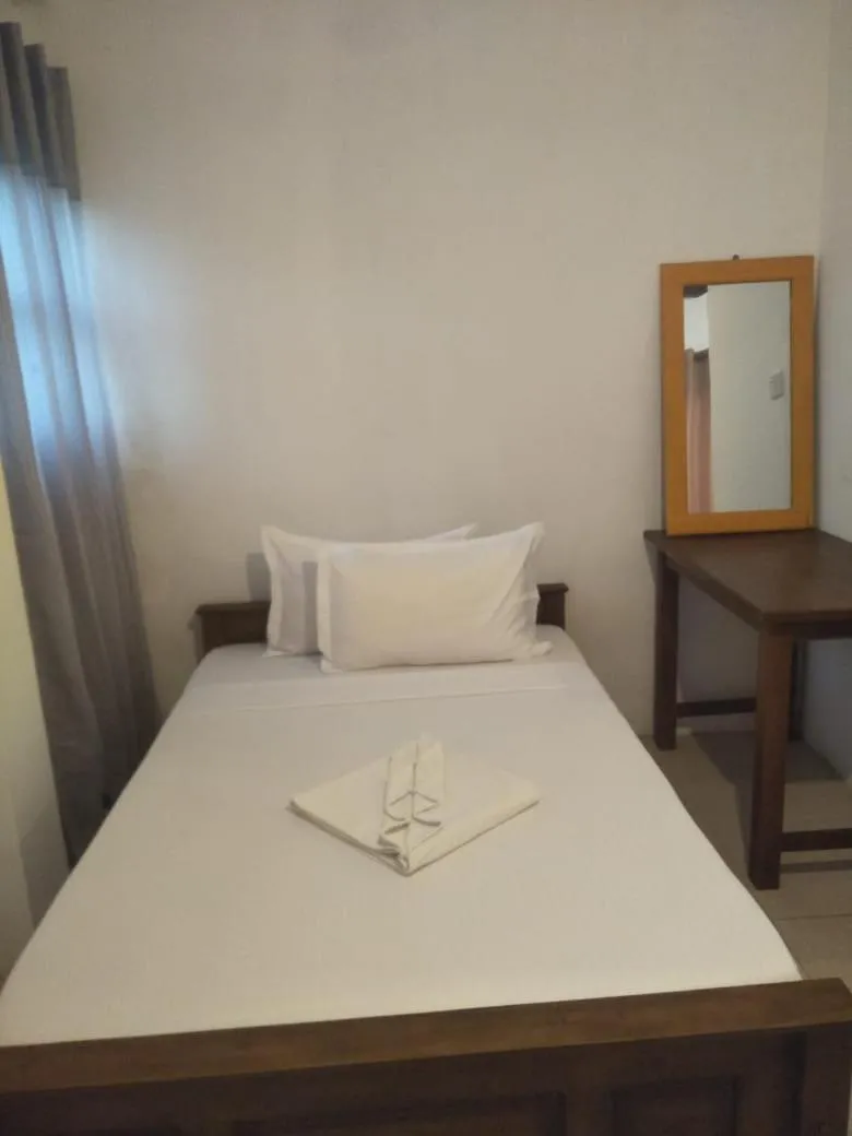 Bed in Bliss Bay Beach Resort & Spa
