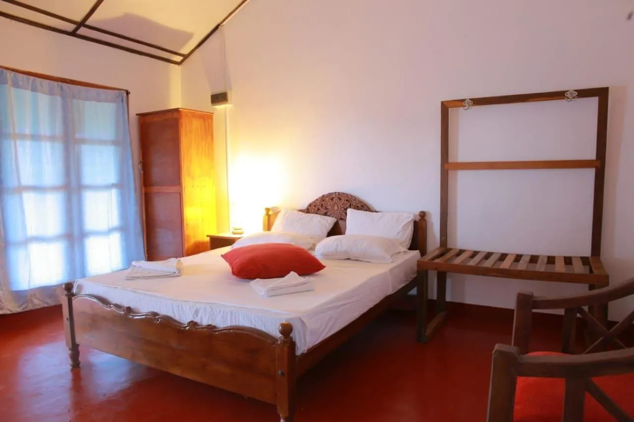 Bed in Bliss Bay Beach Resort & Spa