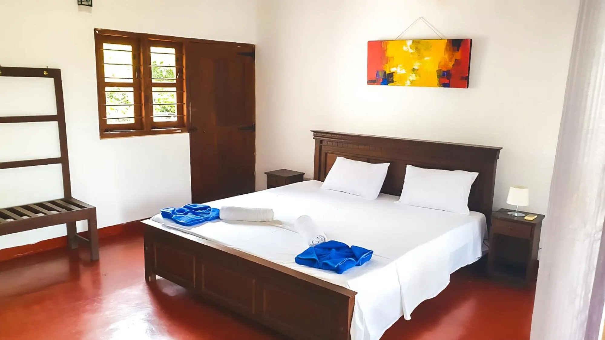 Bed in Bliss Bay Beach Resort & Spa