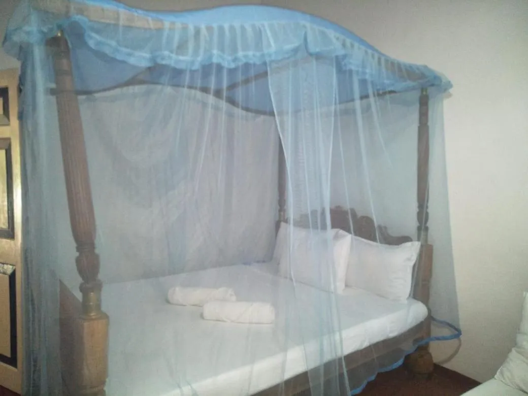 Bed in Bliss Bay Beach Resort & Spa