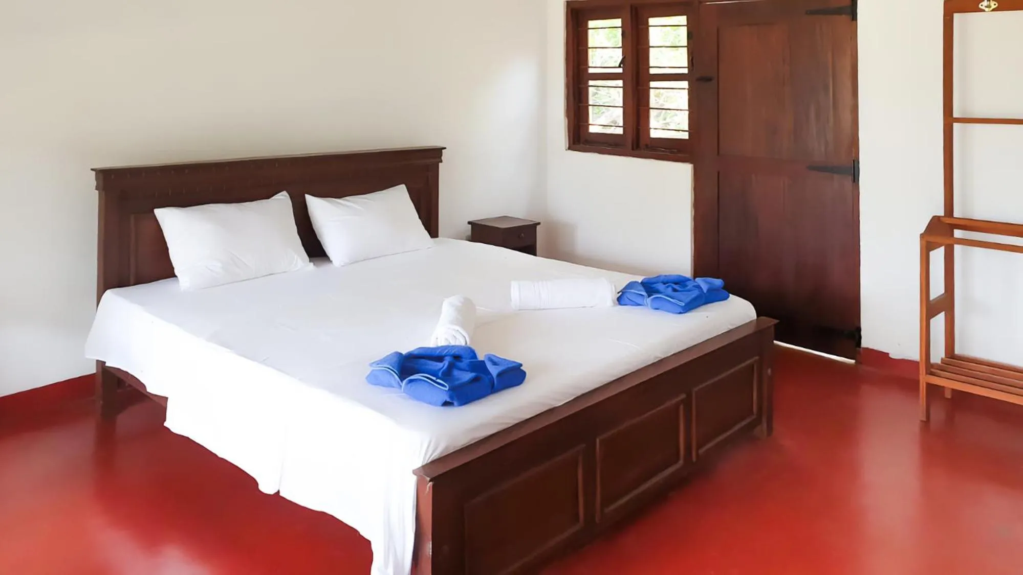Bed in Bliss Bay Beach Resort & Spa