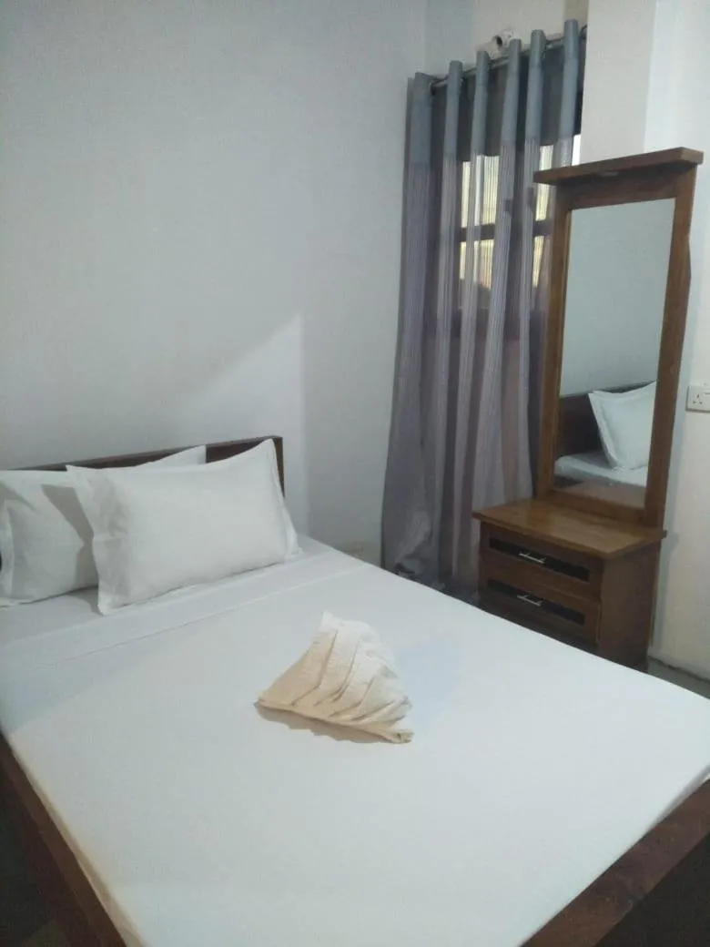 Bed in Bliss Bay Beach Resort & Spa