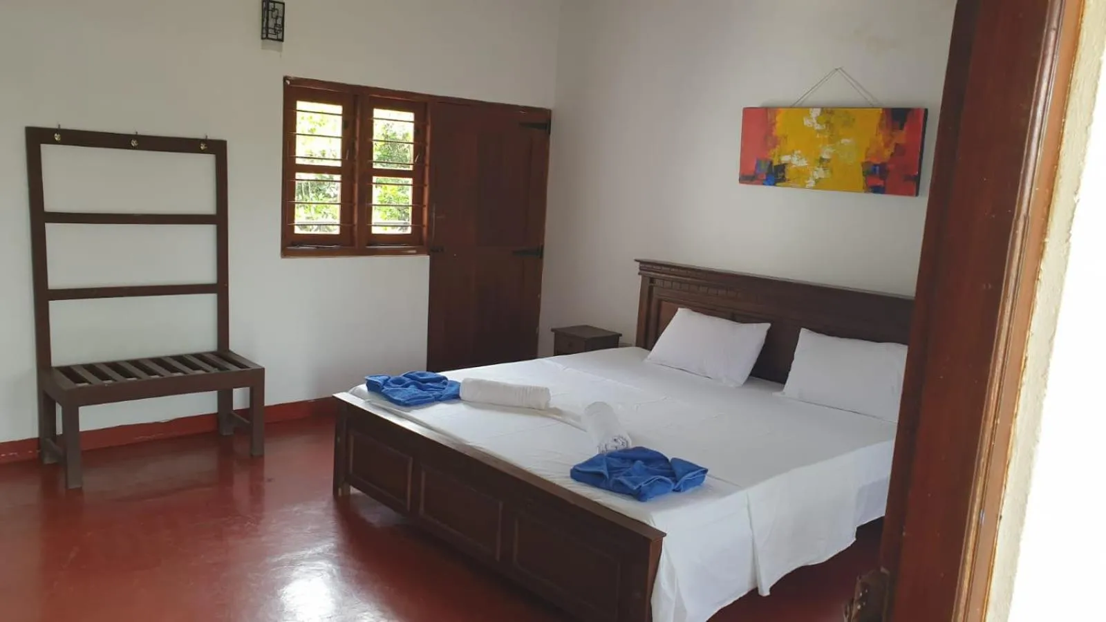 Bed in Bliss Bay Beach Resort & Spa