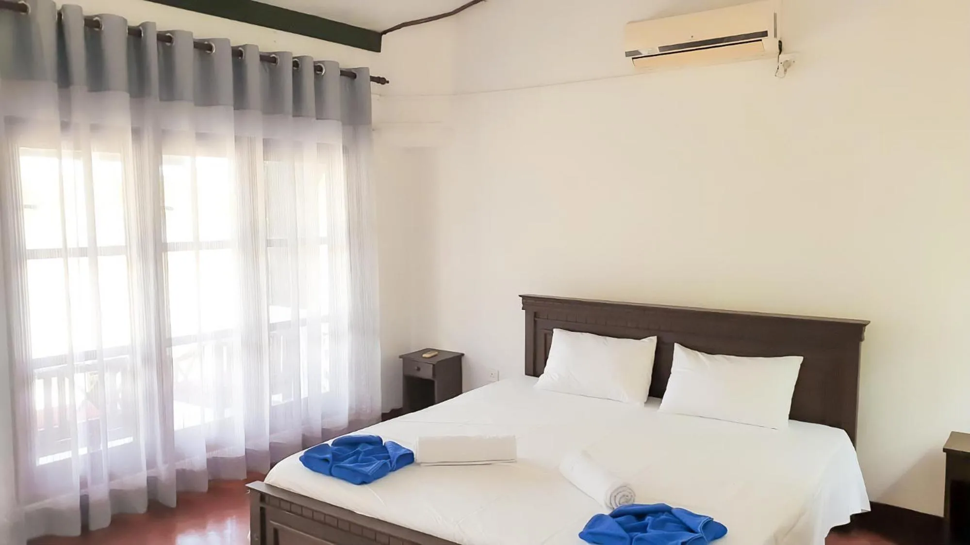 Bed in Bliss Bay Beach Resort & Spa