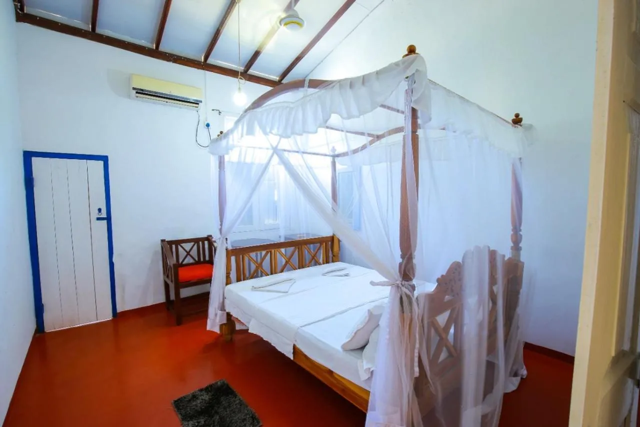 Bed in Bliss Bay Beach Resort & Spa