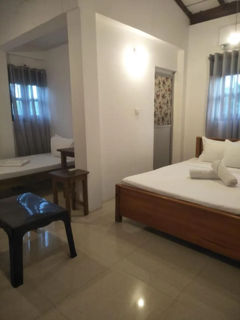Bed in Bliss Bay Beach Resort & Spa