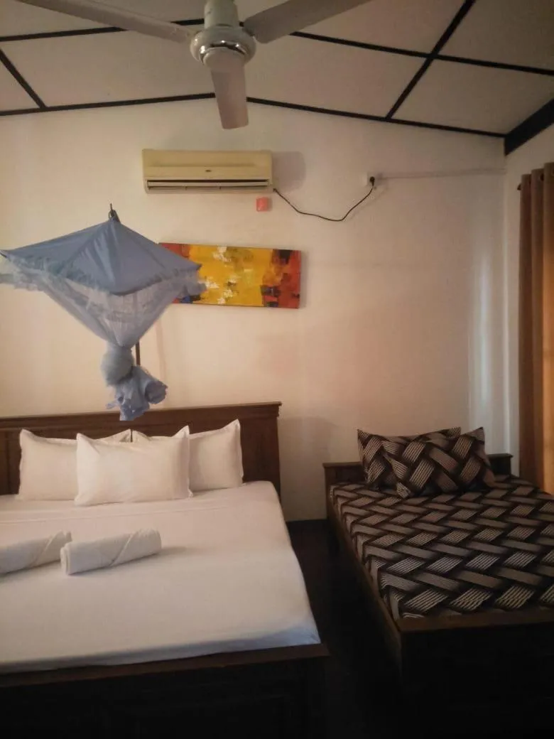 Bed in Bliss Bay Beach Resort & Spa