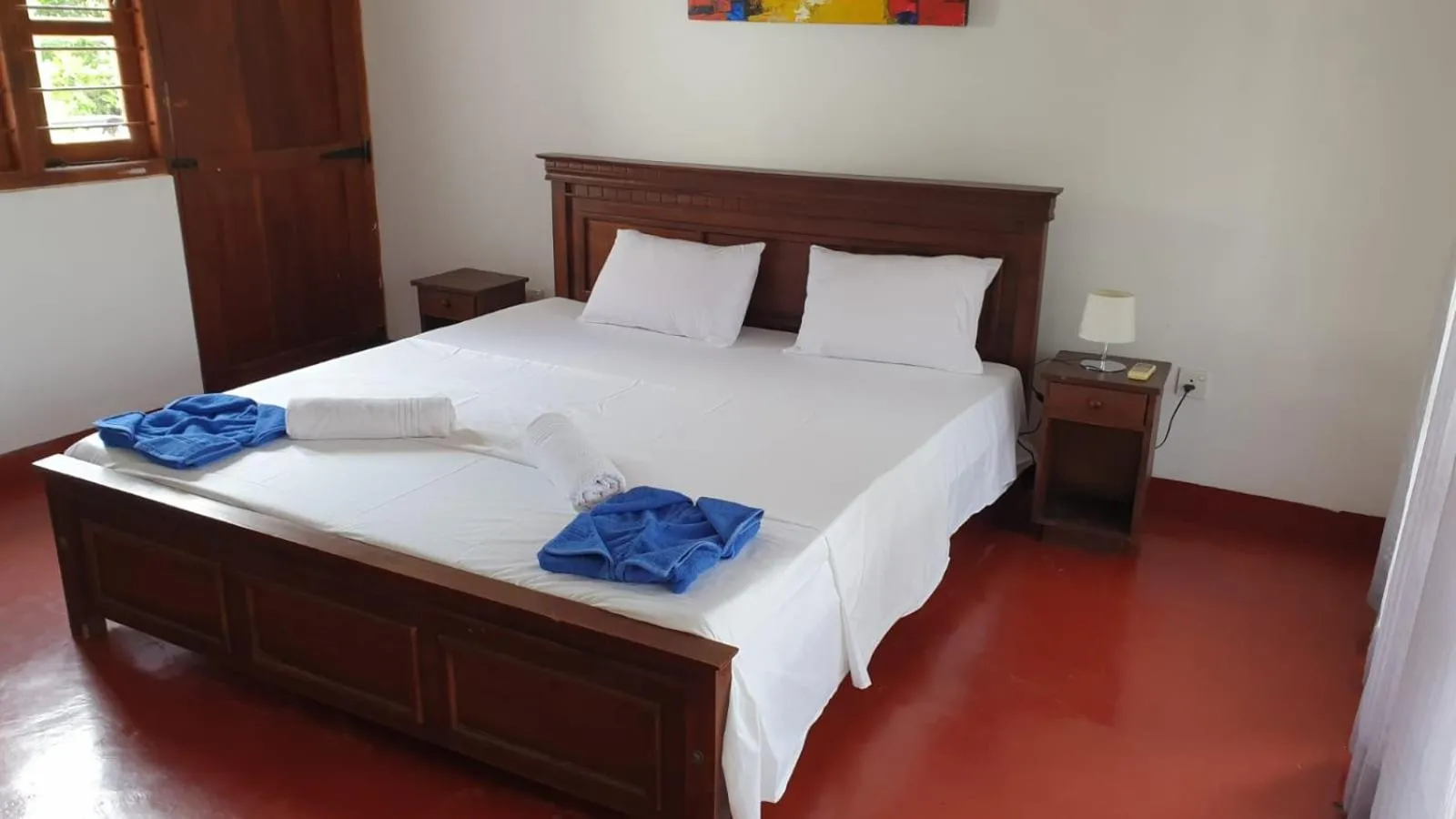 Bed in Bliss Bay Beach Resort & Spa