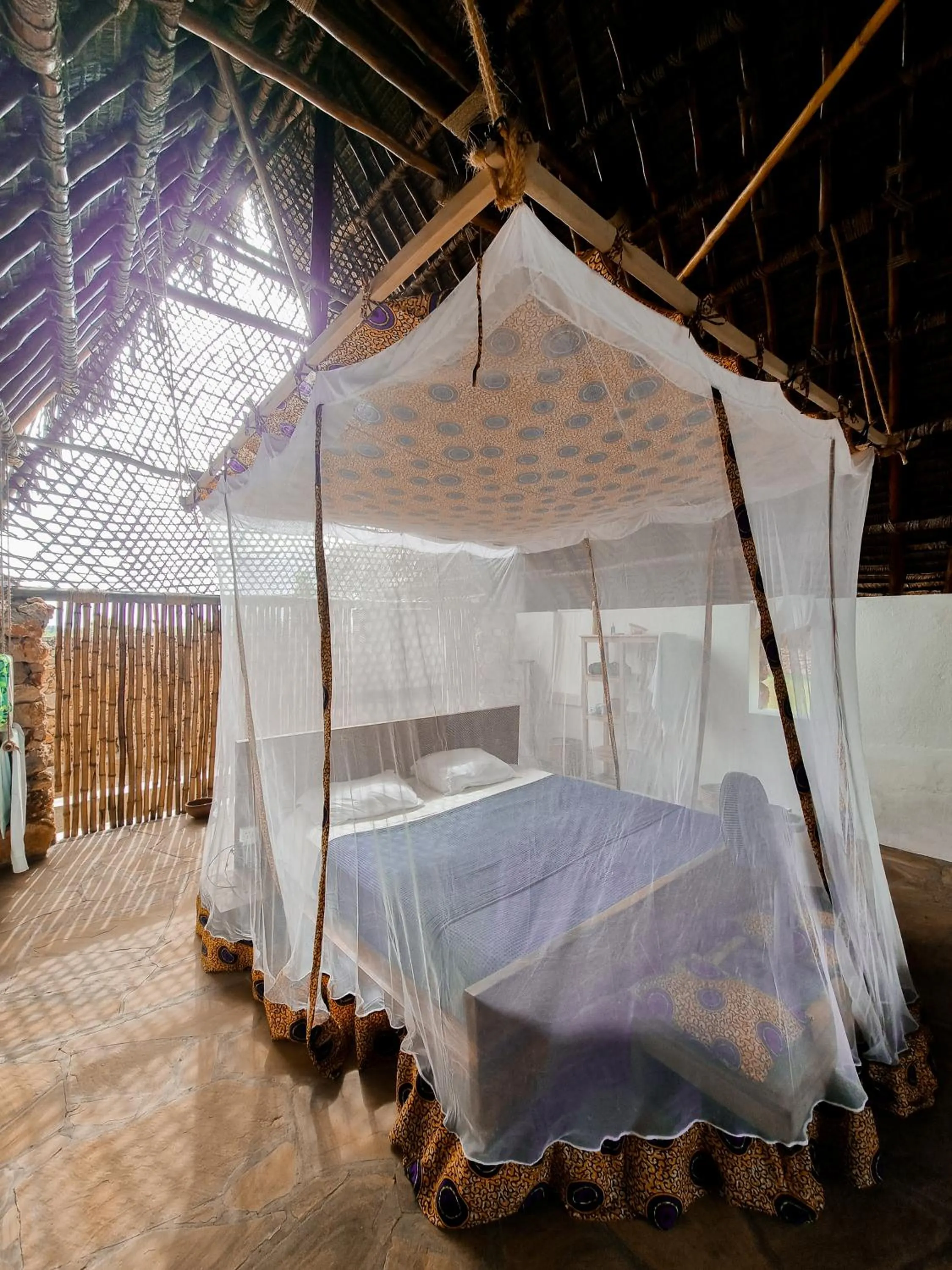 Bed in Pangani Cliffs Lodge