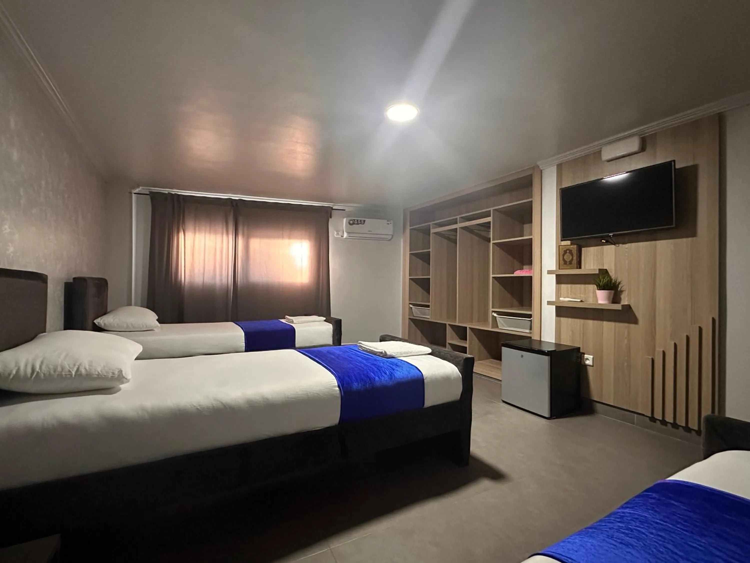 Communal lounge/ TV room, Bed in Hotel Cataleya Al-Hoceima